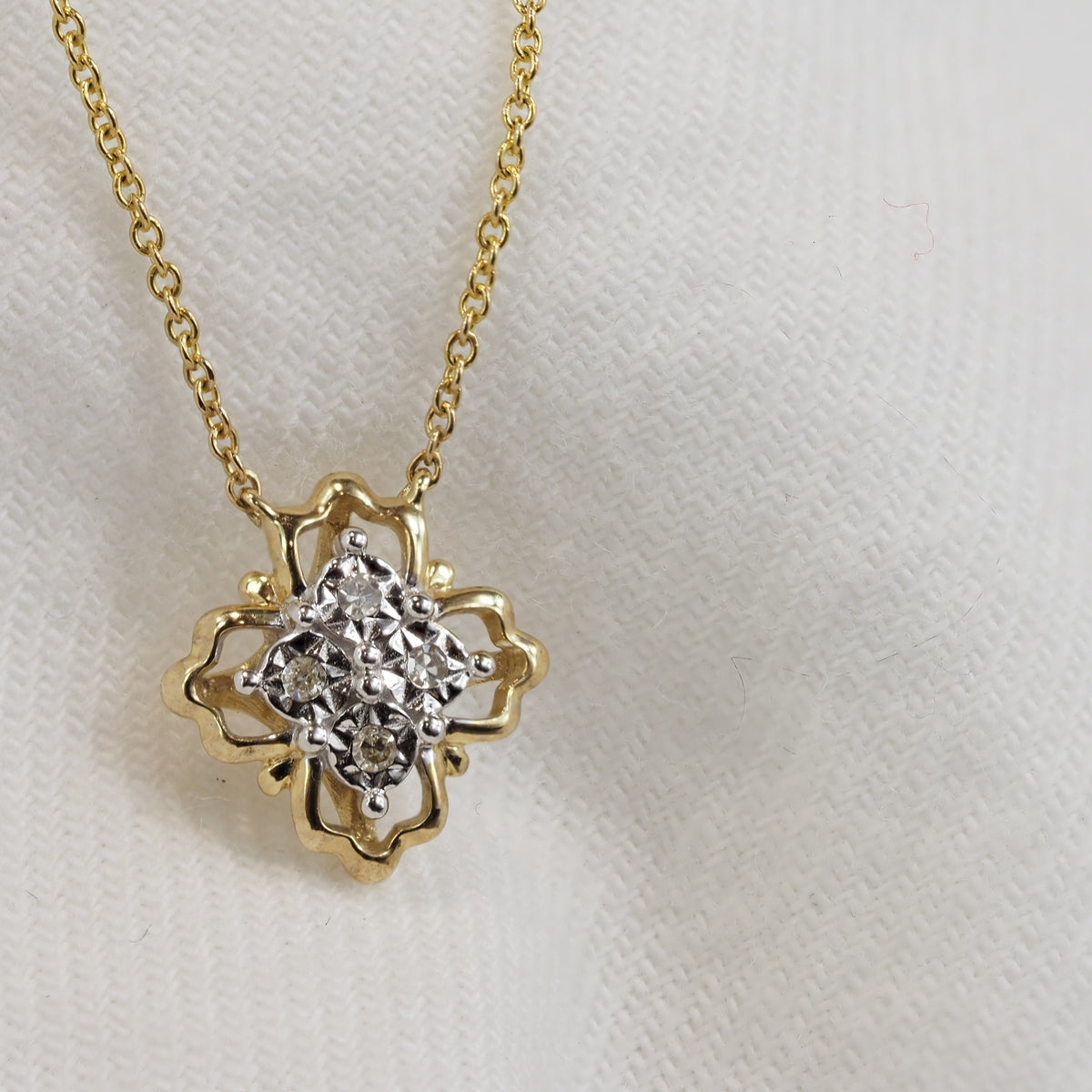 9ct Yellow and White Gold Diamond necklet, 0.028ct total