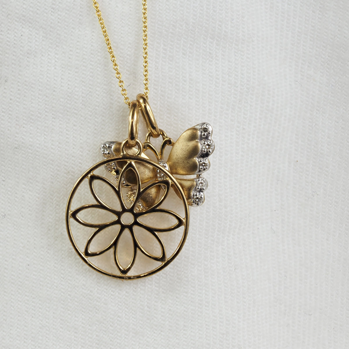 9ct Yellow and White Gold Diamond set Butterfly pendant and cut out flower pendant