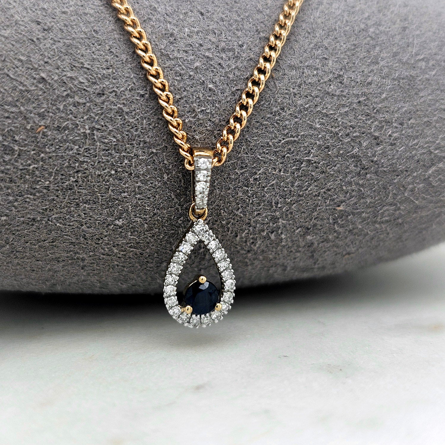 9ct blue sapphire & 0.10ct diamond teardrop pendant