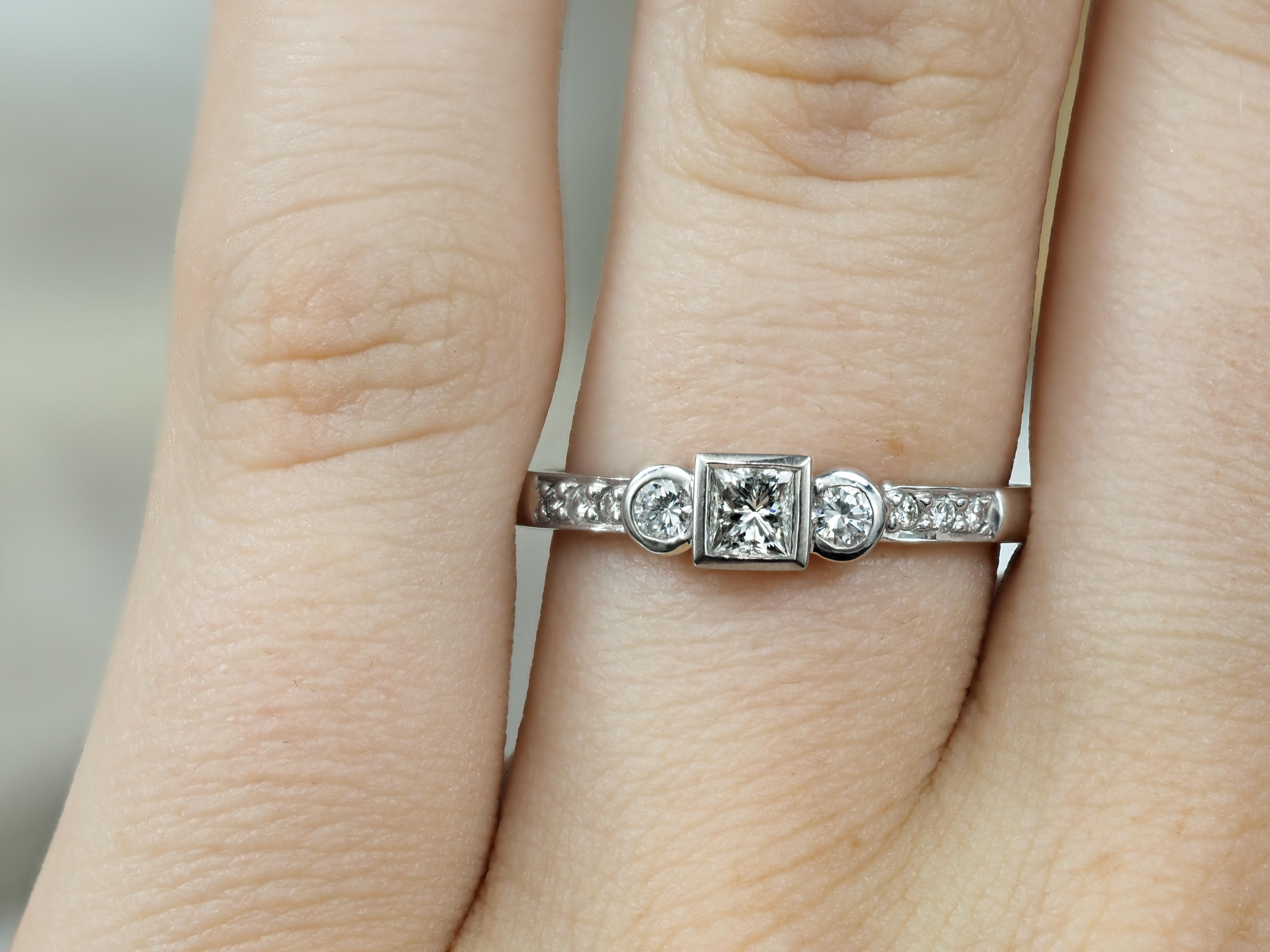 18ct White Gold Princess and Round Brillant cut Diamond Engagement Ring