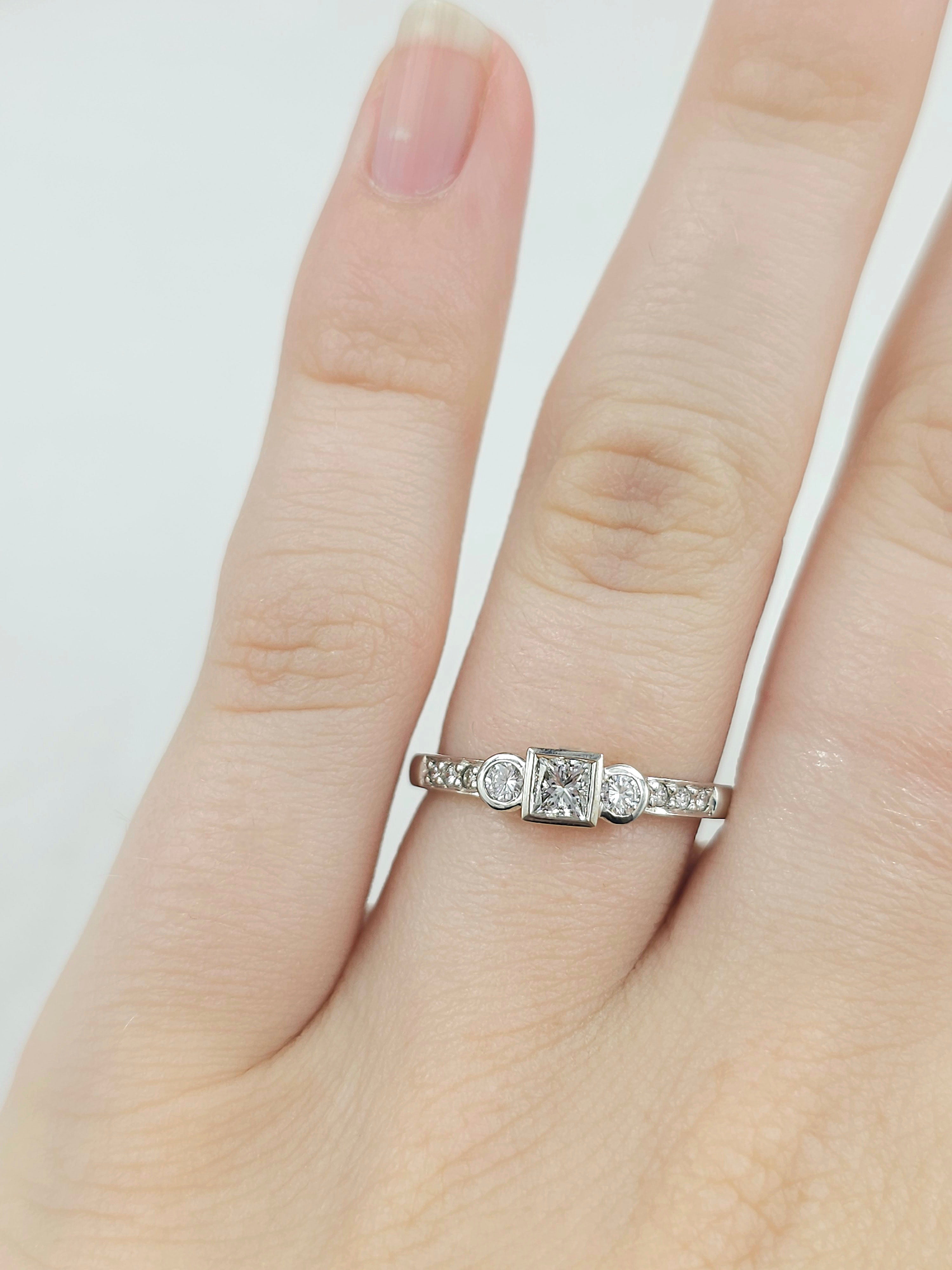 18ct White Gold Princess and Round Brillant cut Diamond engagement ring