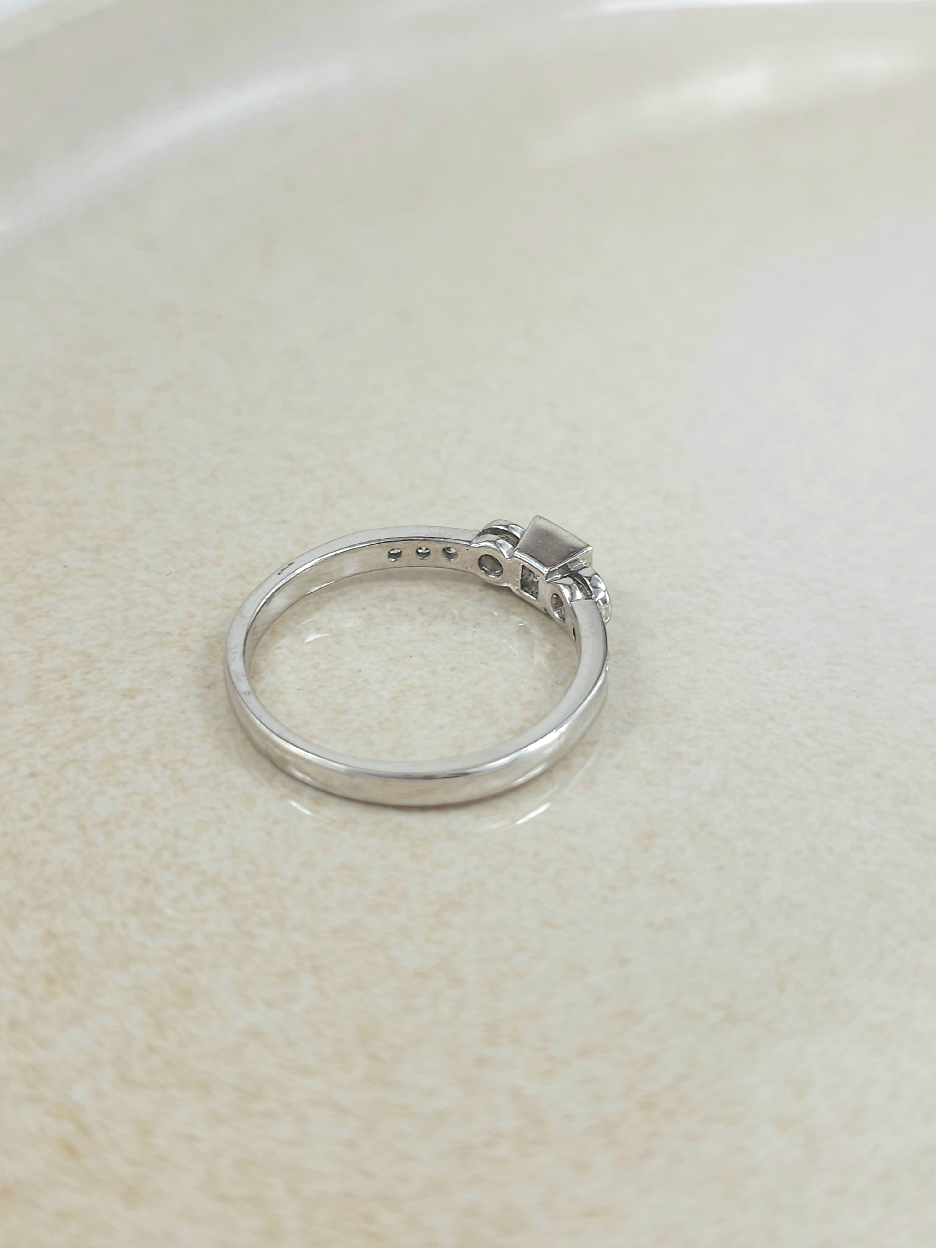 18ct White Gold Princess and Round Brillant cut Diamond engagement ring