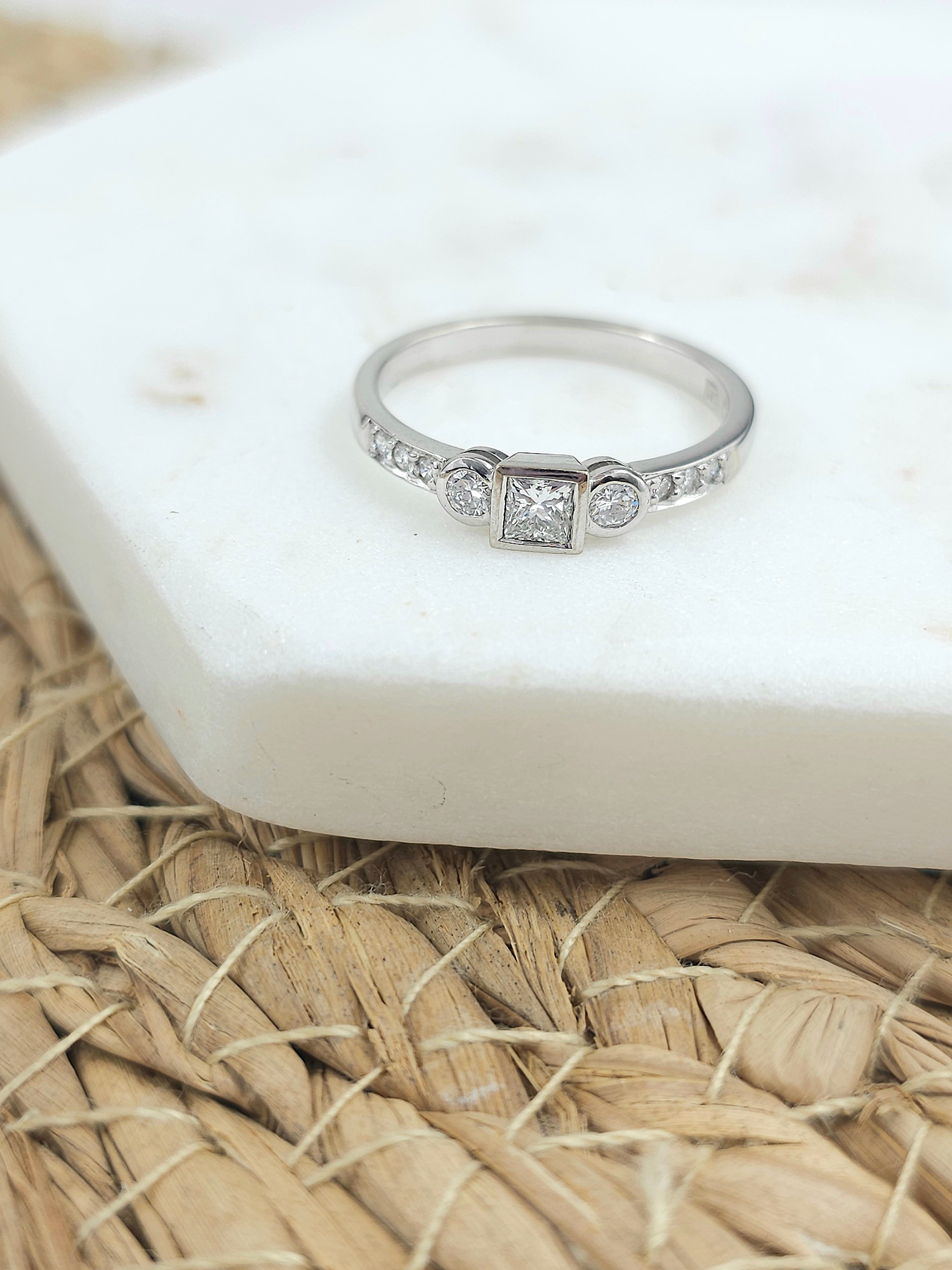 18ct White Gold Princess and Round Brillant cut Diamond engagement ring