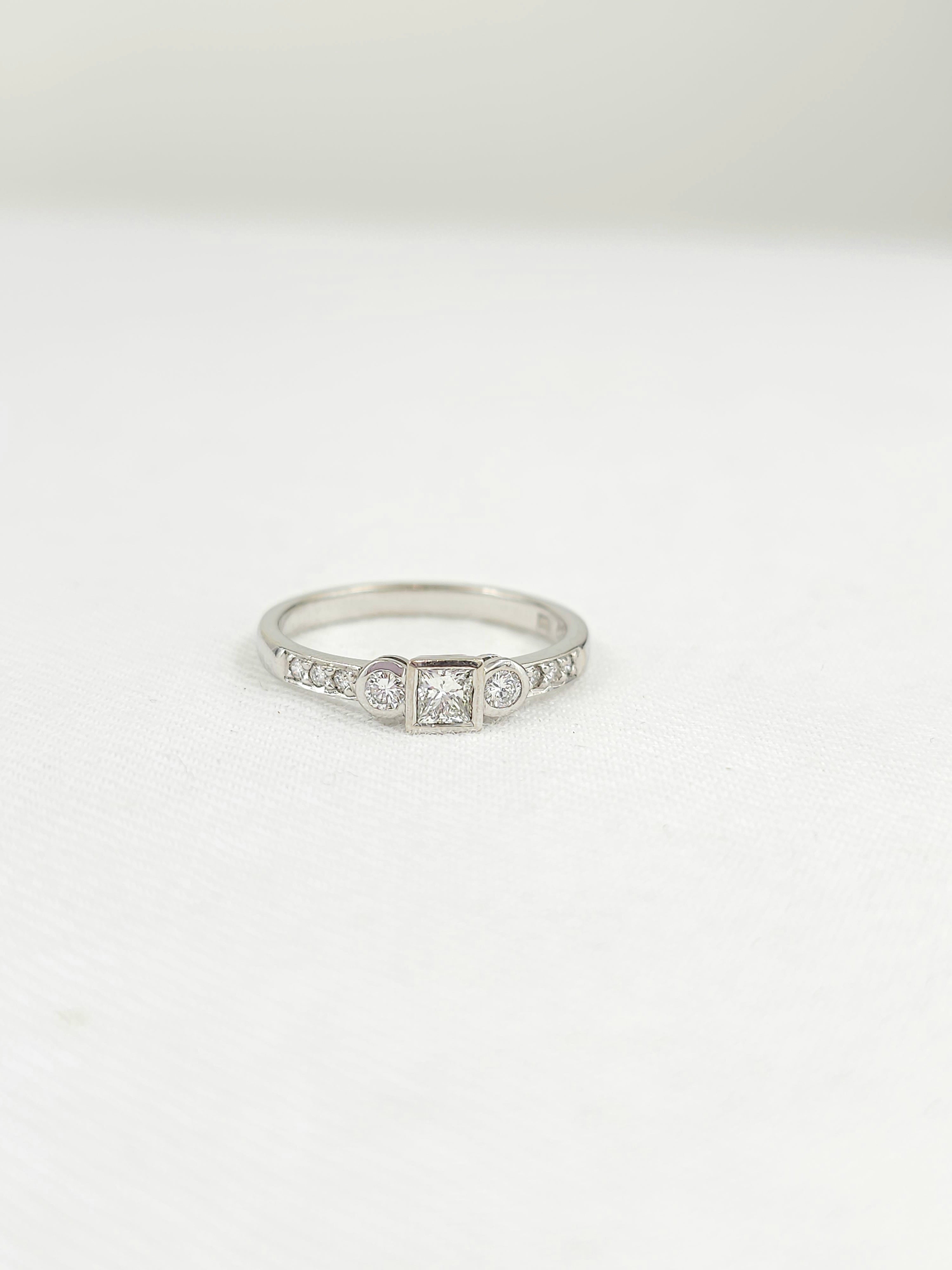 18ct White Gold Princess and Round Brillant cut Diamond engagement ring