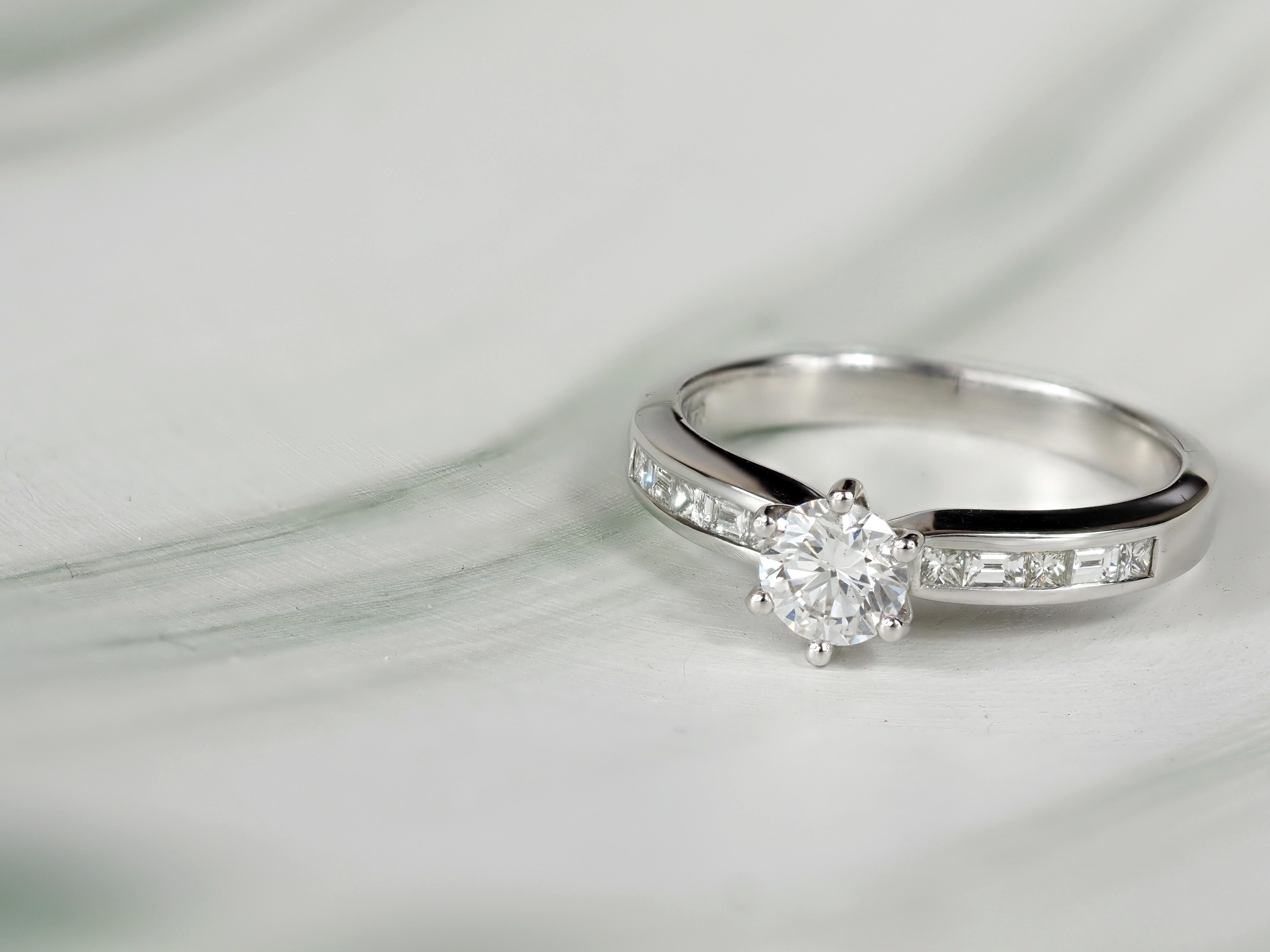 18ct White Gold Round Brilliant, Princess and Baguette Cut Diamond Engagement Ring, 0.54ct Centre