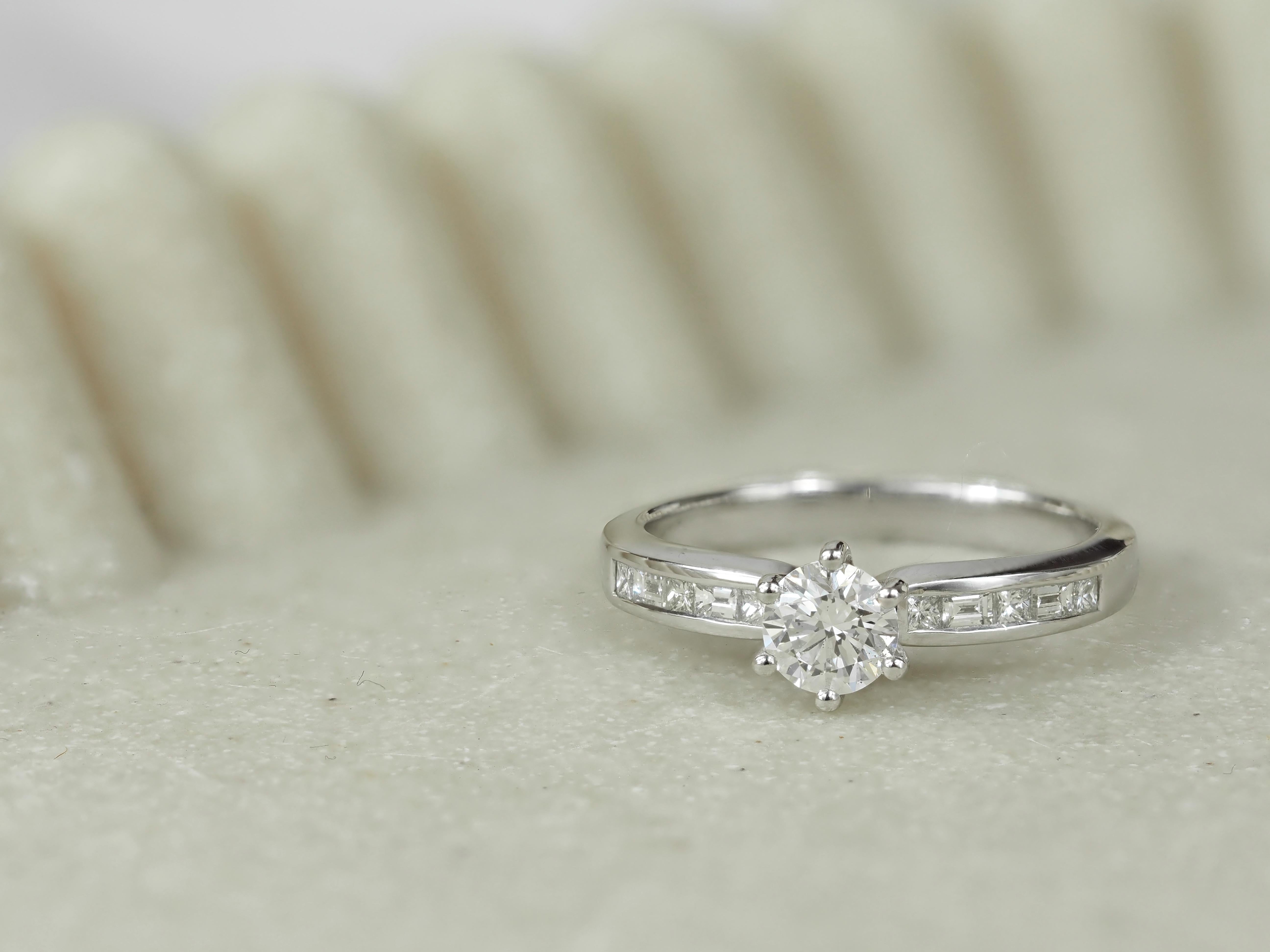 18ct White Gold Round Brilliant, Princess and Baguette Cut Diamond Engagement Ring, 0.54ct Centre