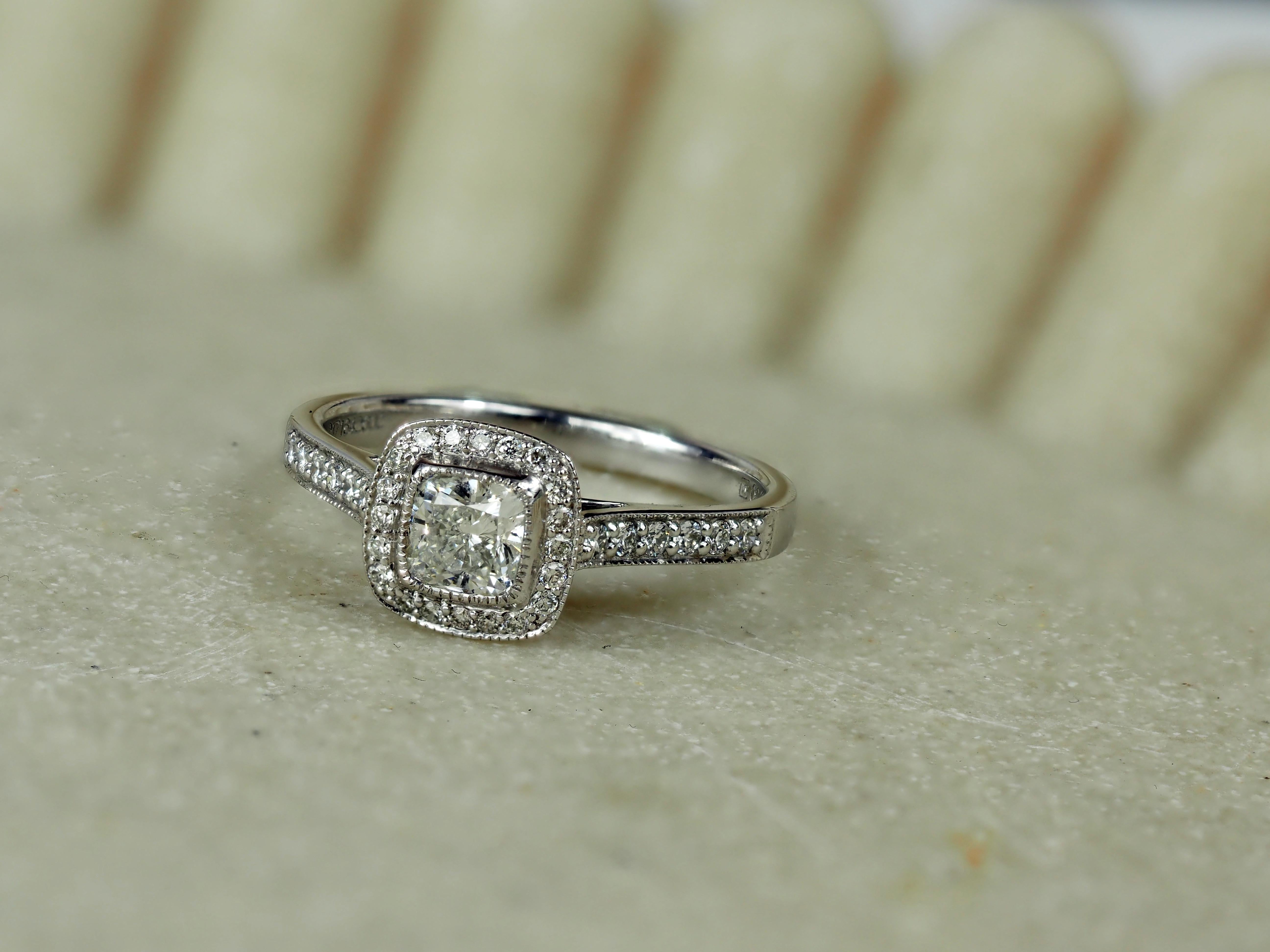 18 Carat White Gold Cushion Halo Engagement Ring, 0.72 carats.