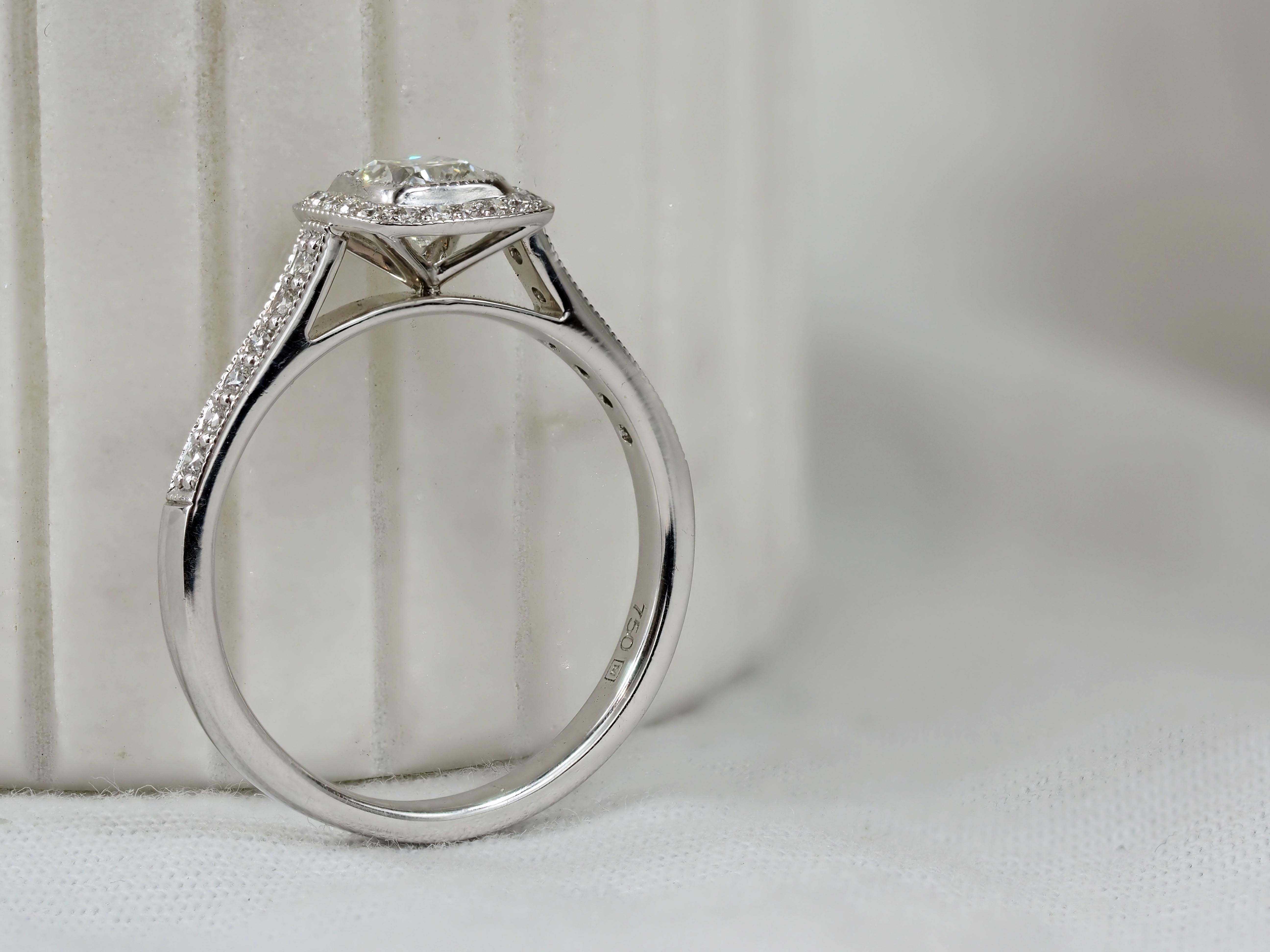 18 Carat White Gold Cushion Halo Engagement Ring, 0.72 carats.