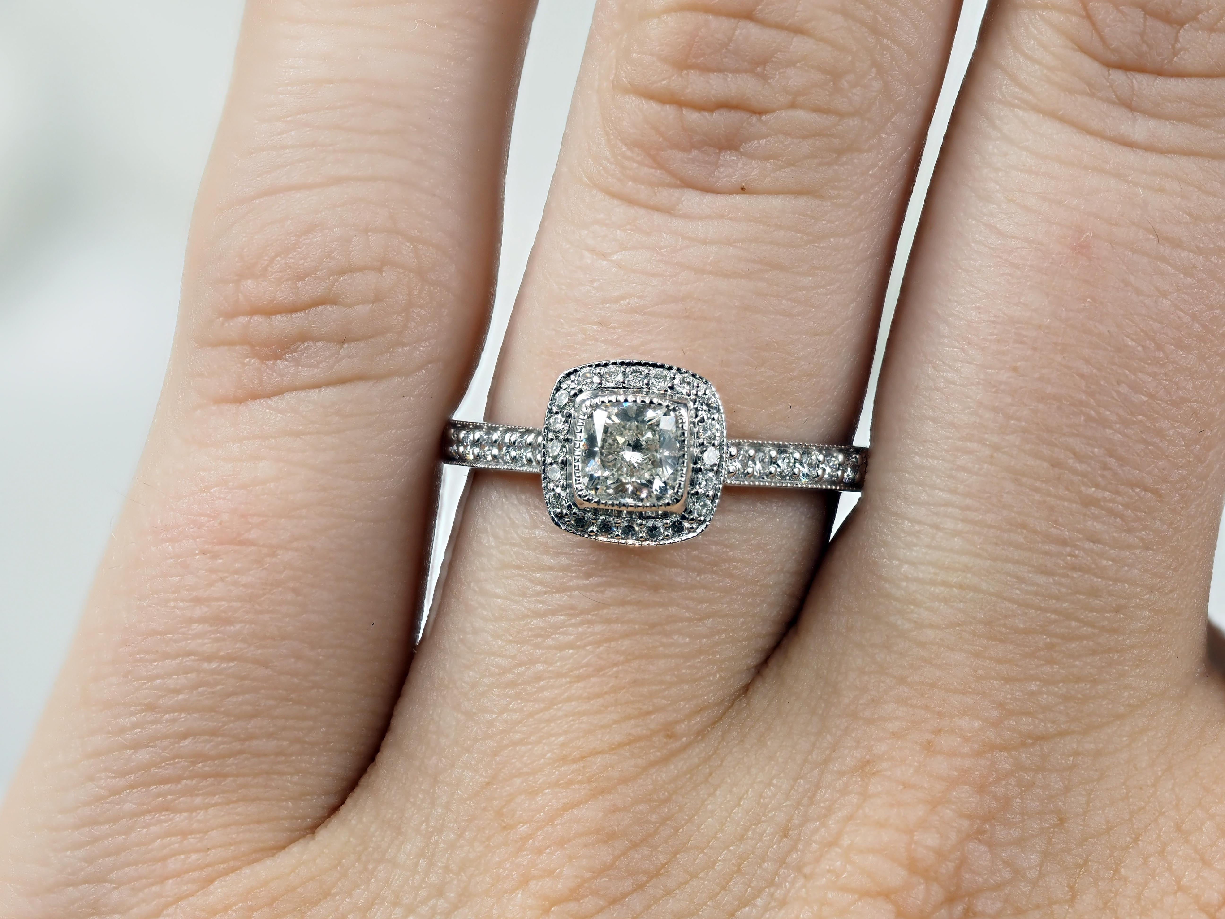 18 Carat White Gold Cushion Halo Engagement Ring, 0.72 carats.