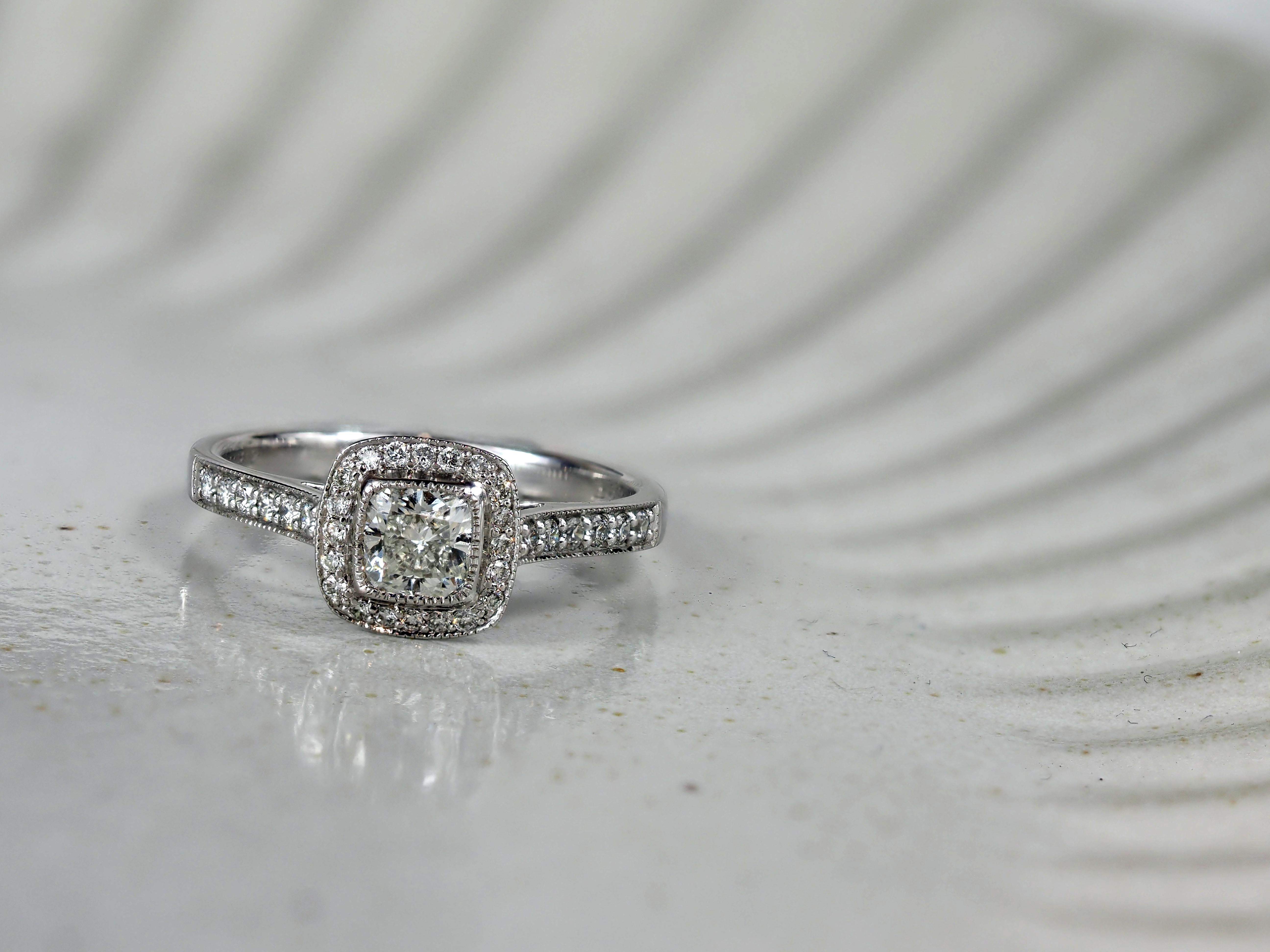 18 Carat White Gold Cushion Halo Engagement Ring, 0.72 carats.