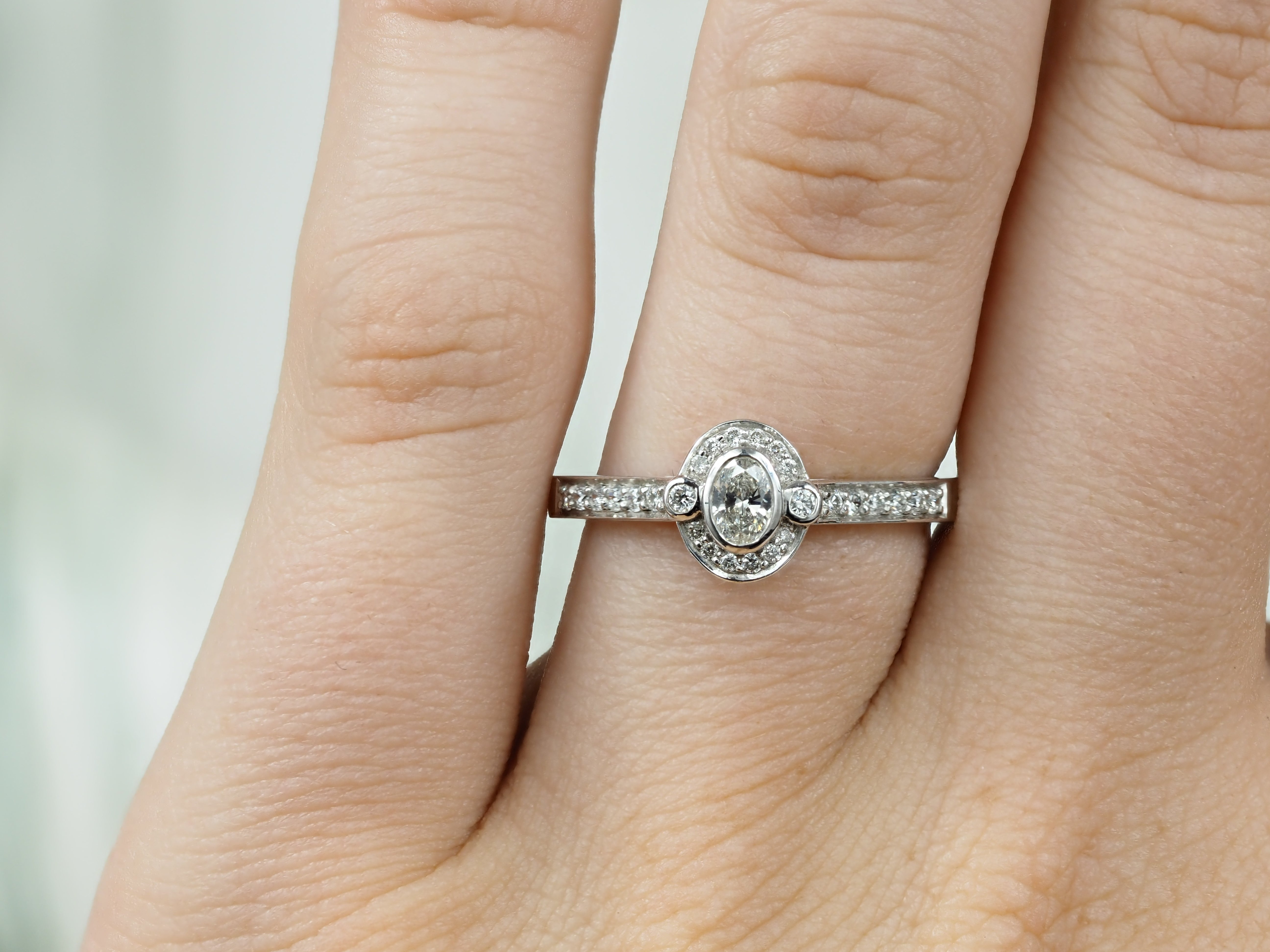 18ct White Gold Oval Cut Diamond Halo Engagement Ring, 0.15ct Centre