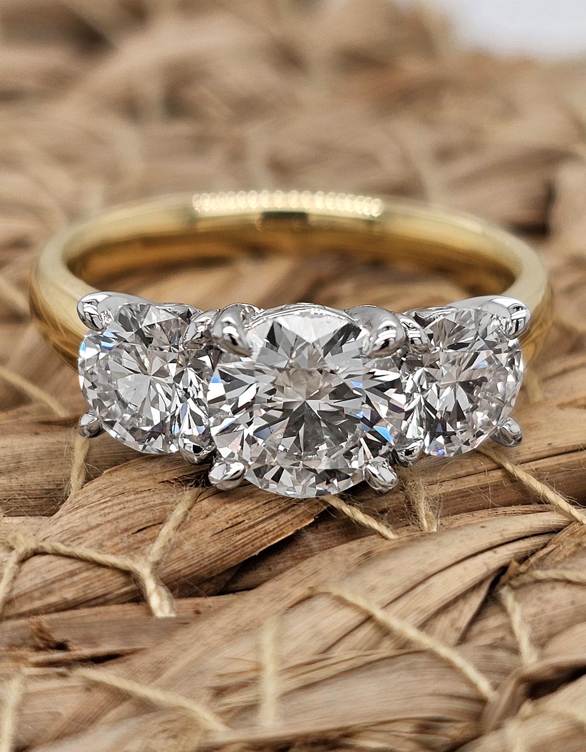 2.35 carat total VERO lab-grown Round Trilogy Diamond ring.