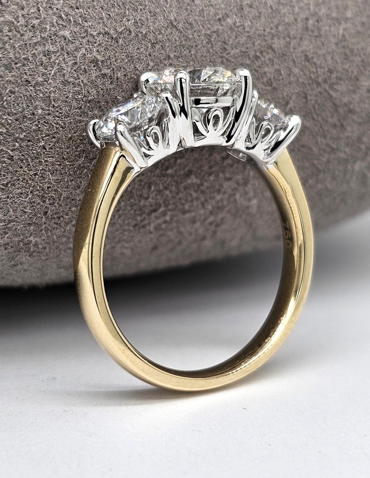 2.35 carat total VERO lab-grown Round Trilogy Diamond ring.