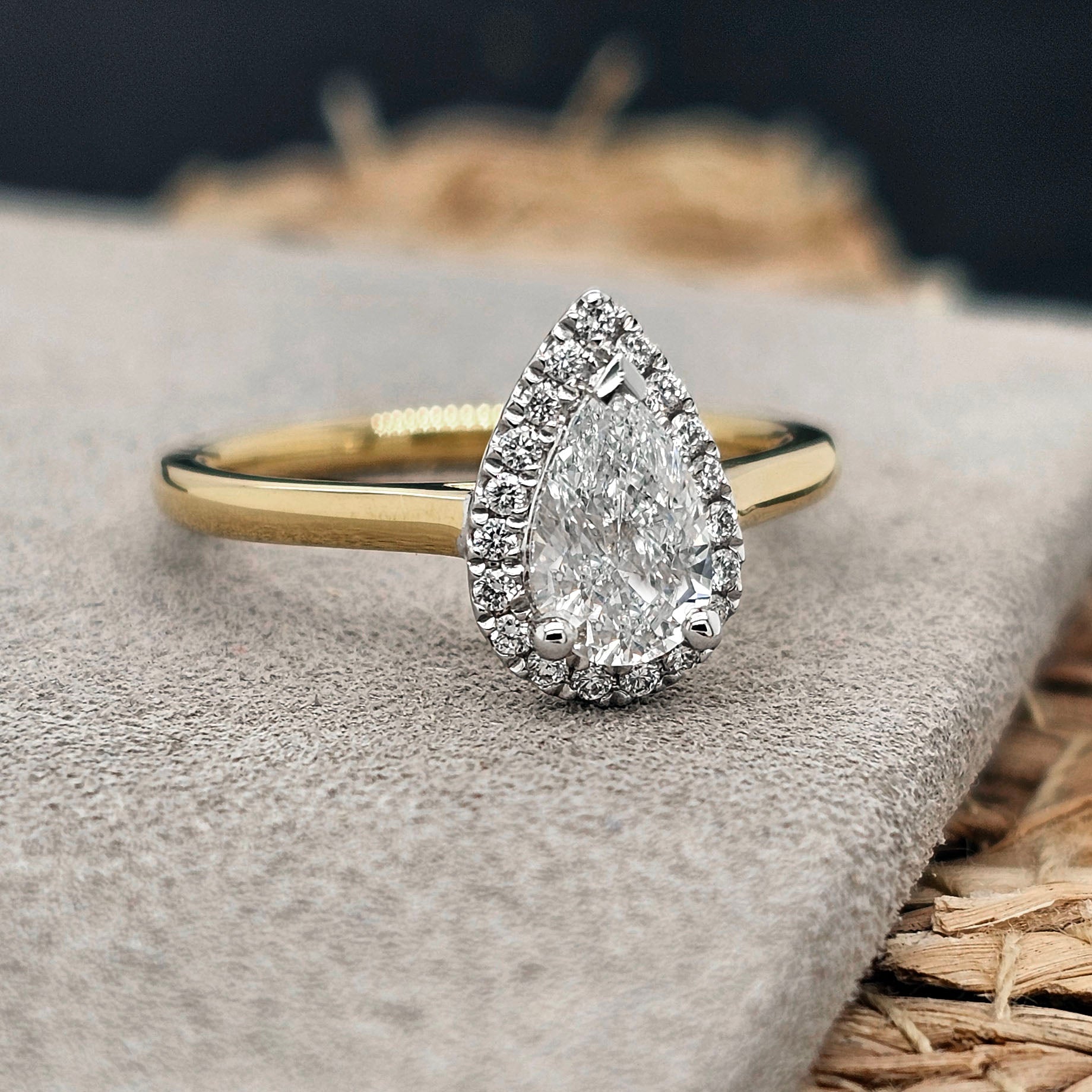 18 Carat Yellow & White Gold Pear Halo Ring, 0.70 carat centre.