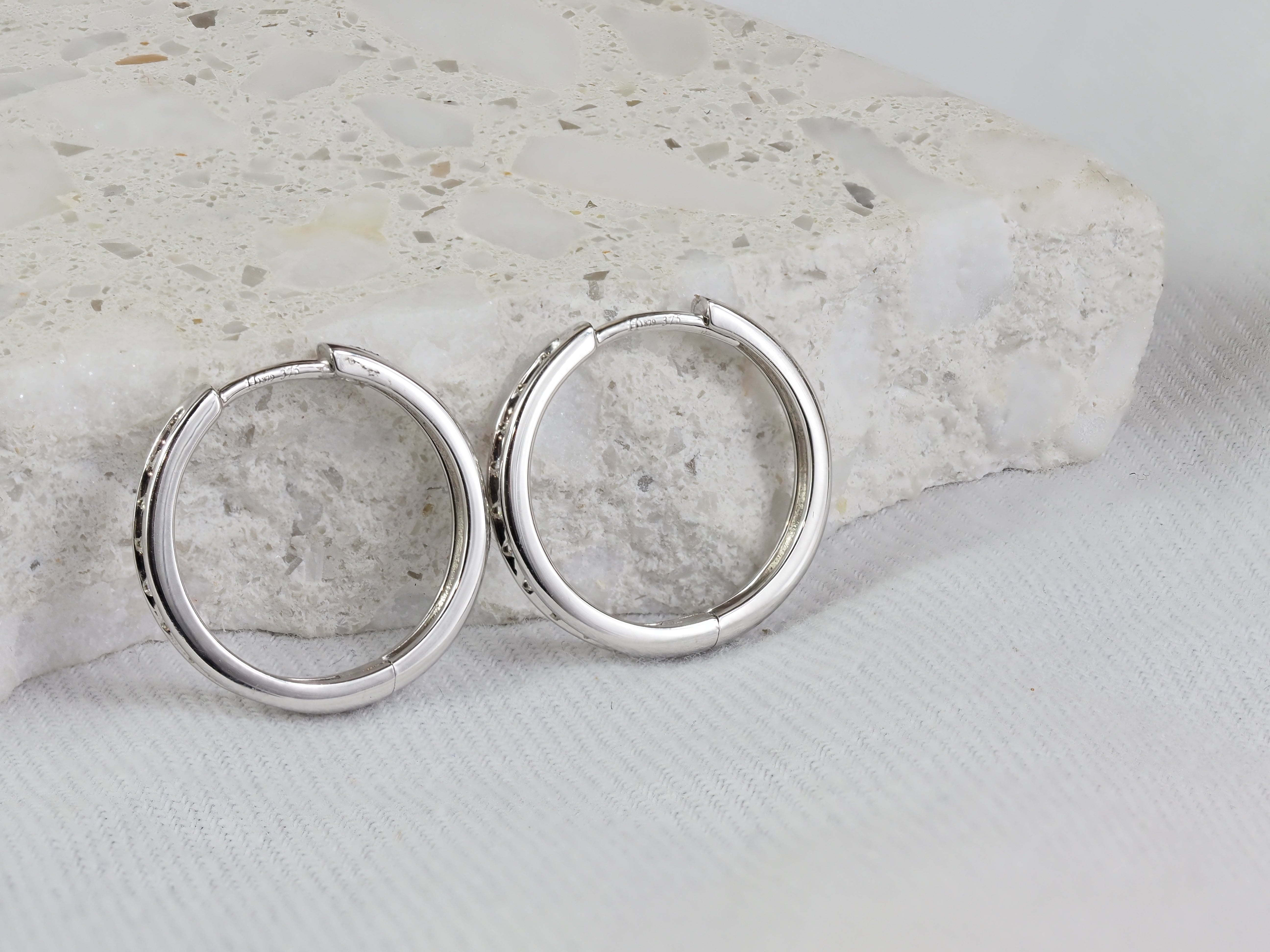9ct White Gold Diamond Channel Set Huggie Earrings, Total 0.15ct