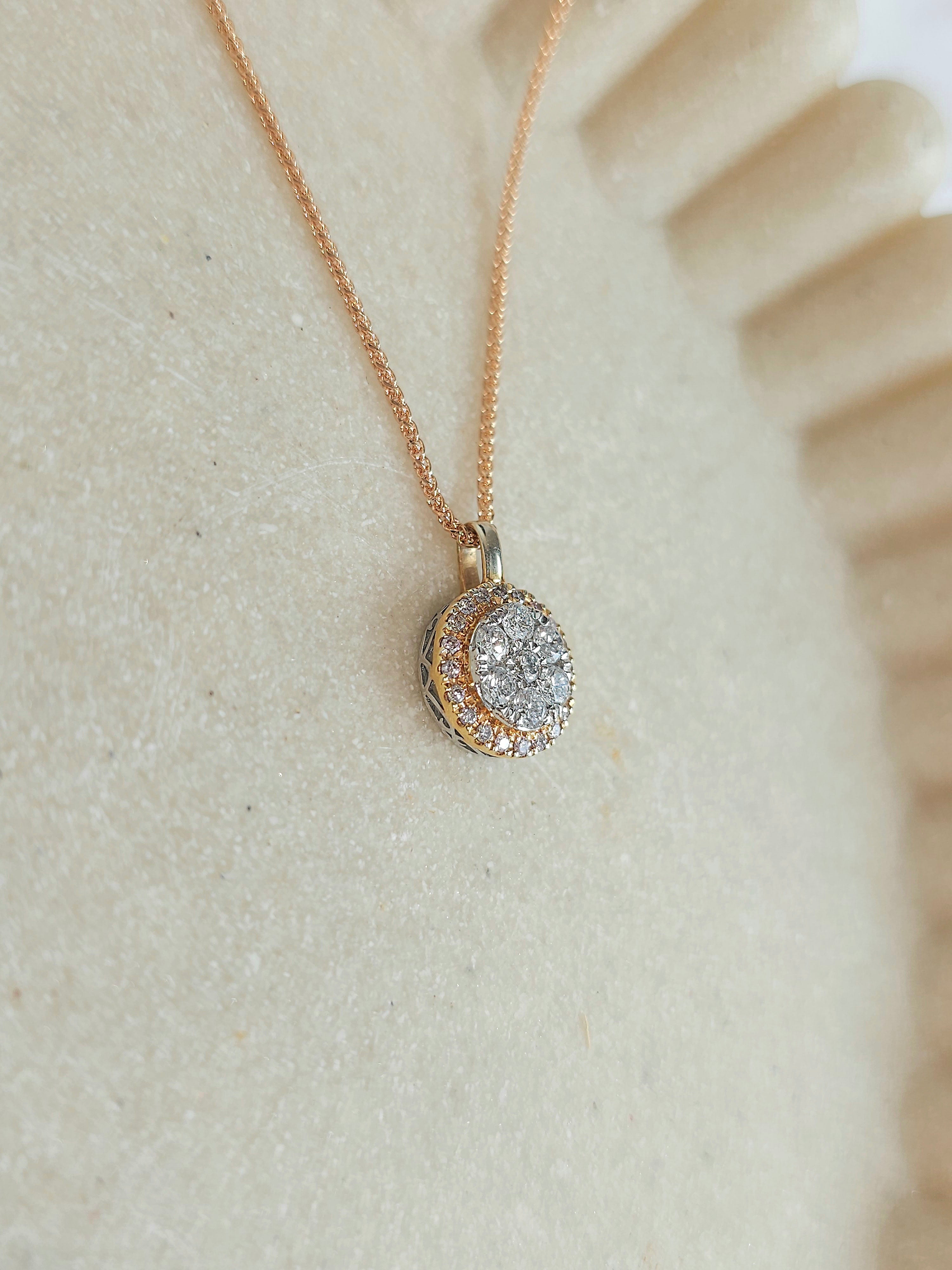 9ct Rose and White Gold Diamond and Pink Diamond pendant, 0.53ct total