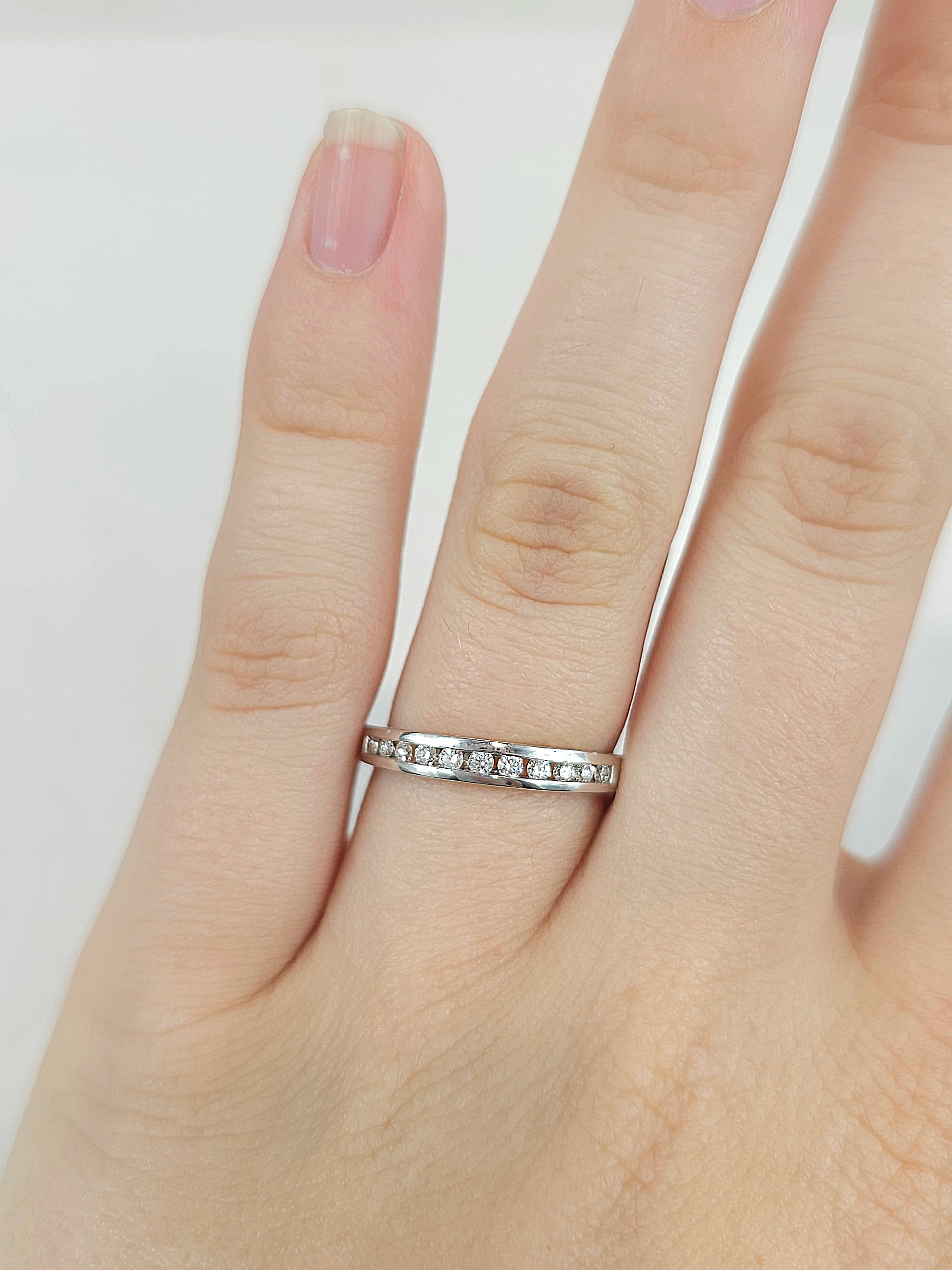 18ct White Gold channel set, diamond wedding band, equaling 0.22ct