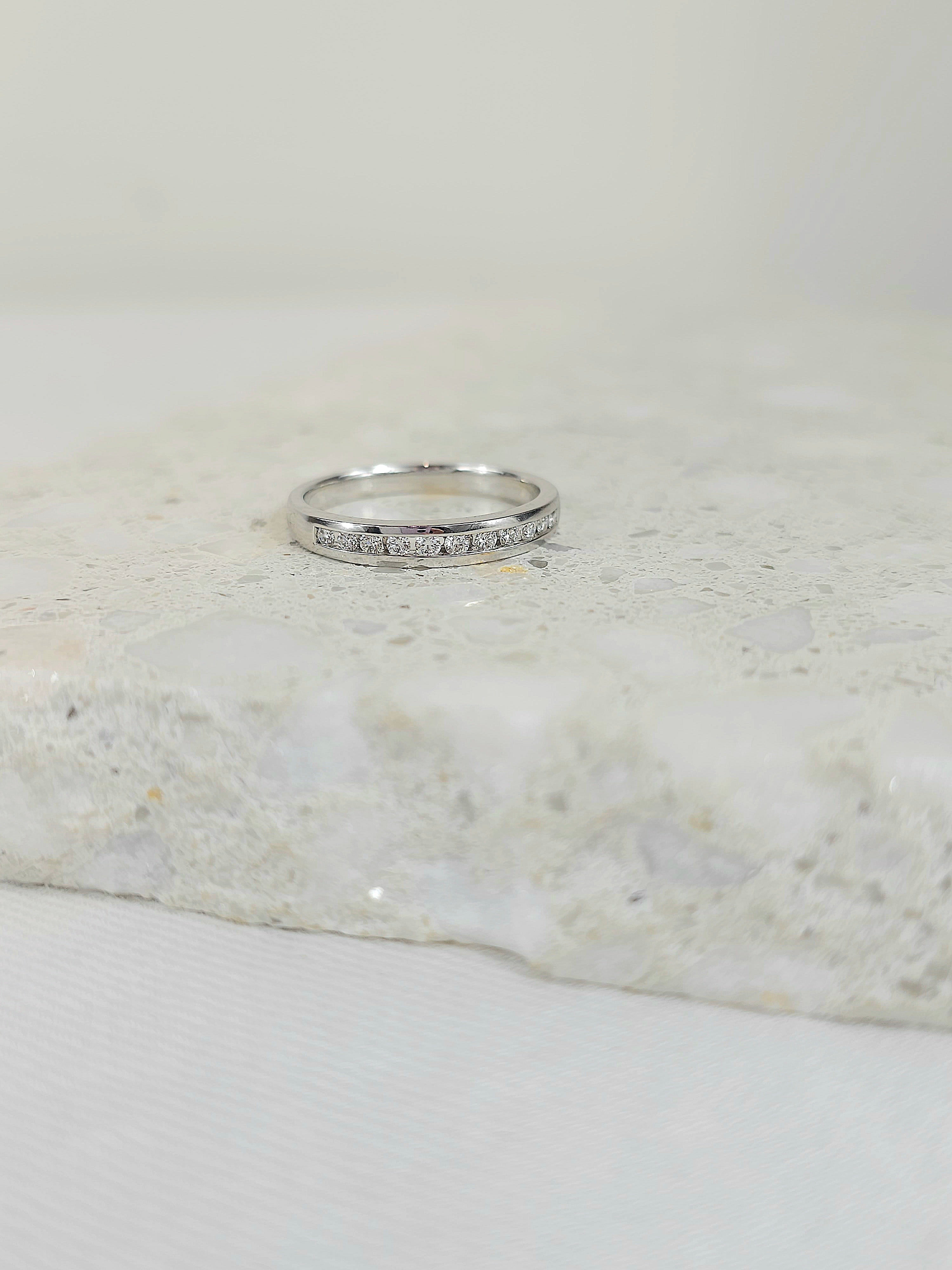 18ct White Gold channel set, diamond wedding band, equaling 0.22ct