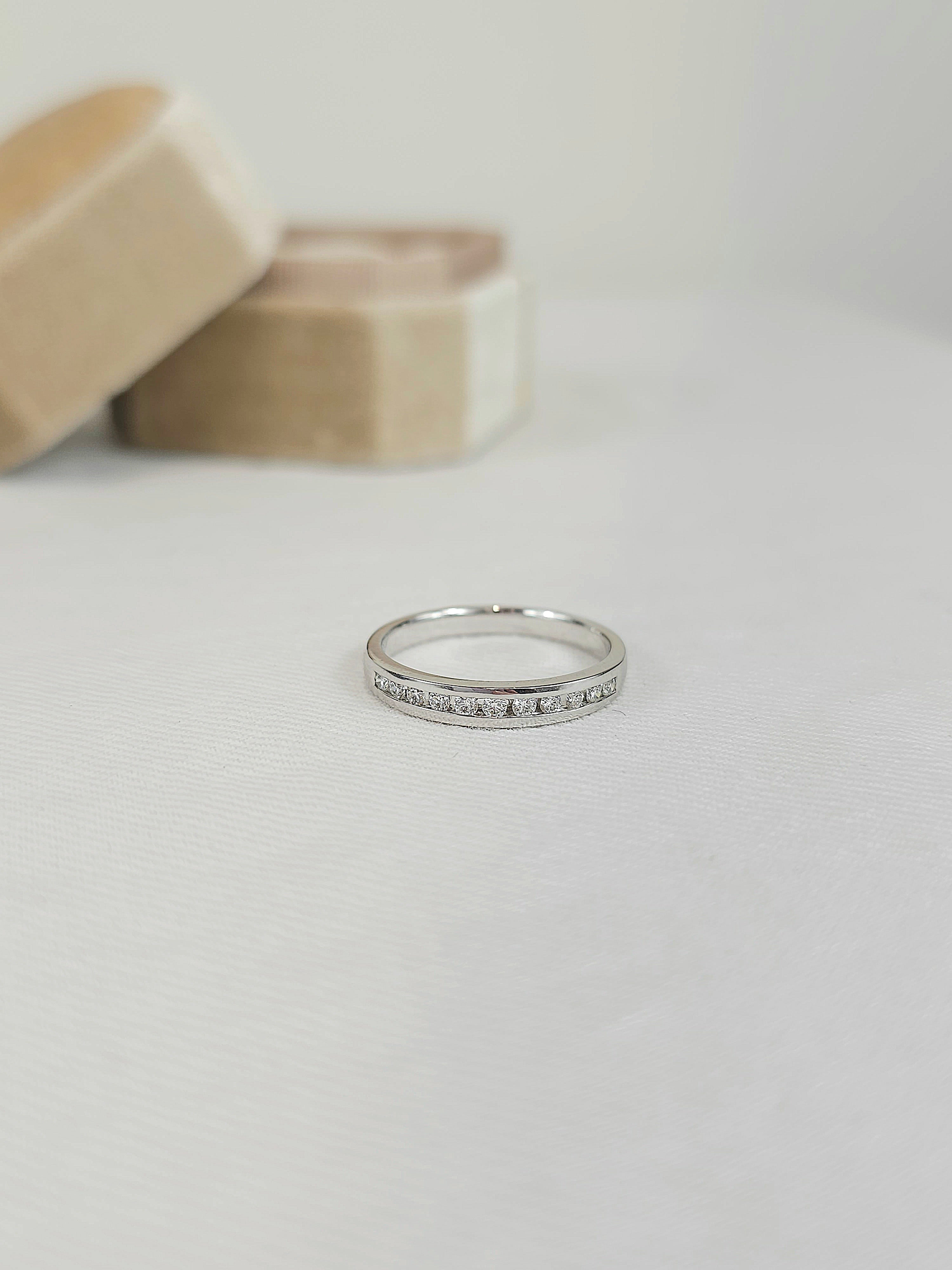 18ct White Gold channel set, diamond wedding band, equaling 0.22ct