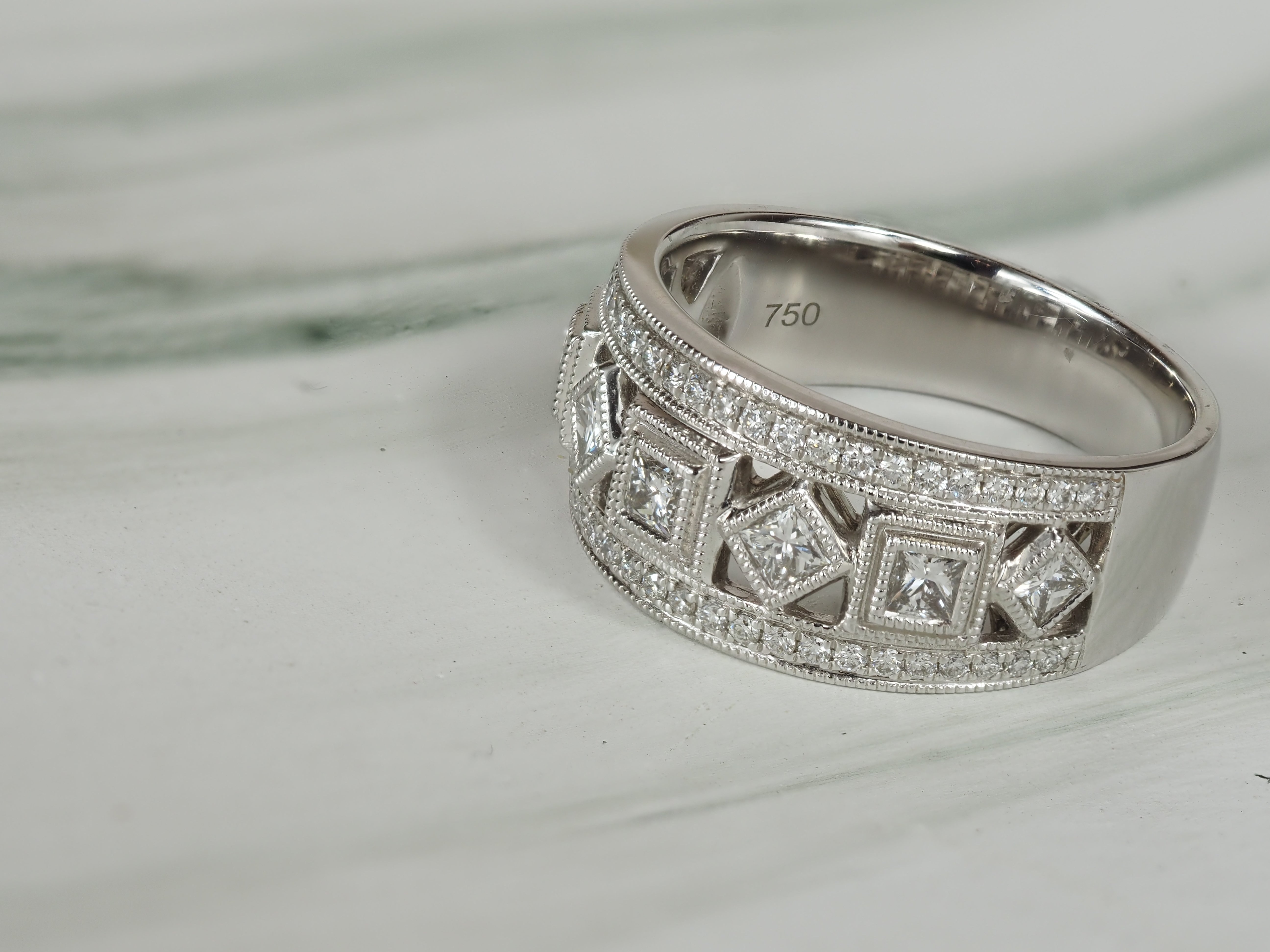 18ct White Gold Round Brilliant and Princess Cut Diamond Dress Ring