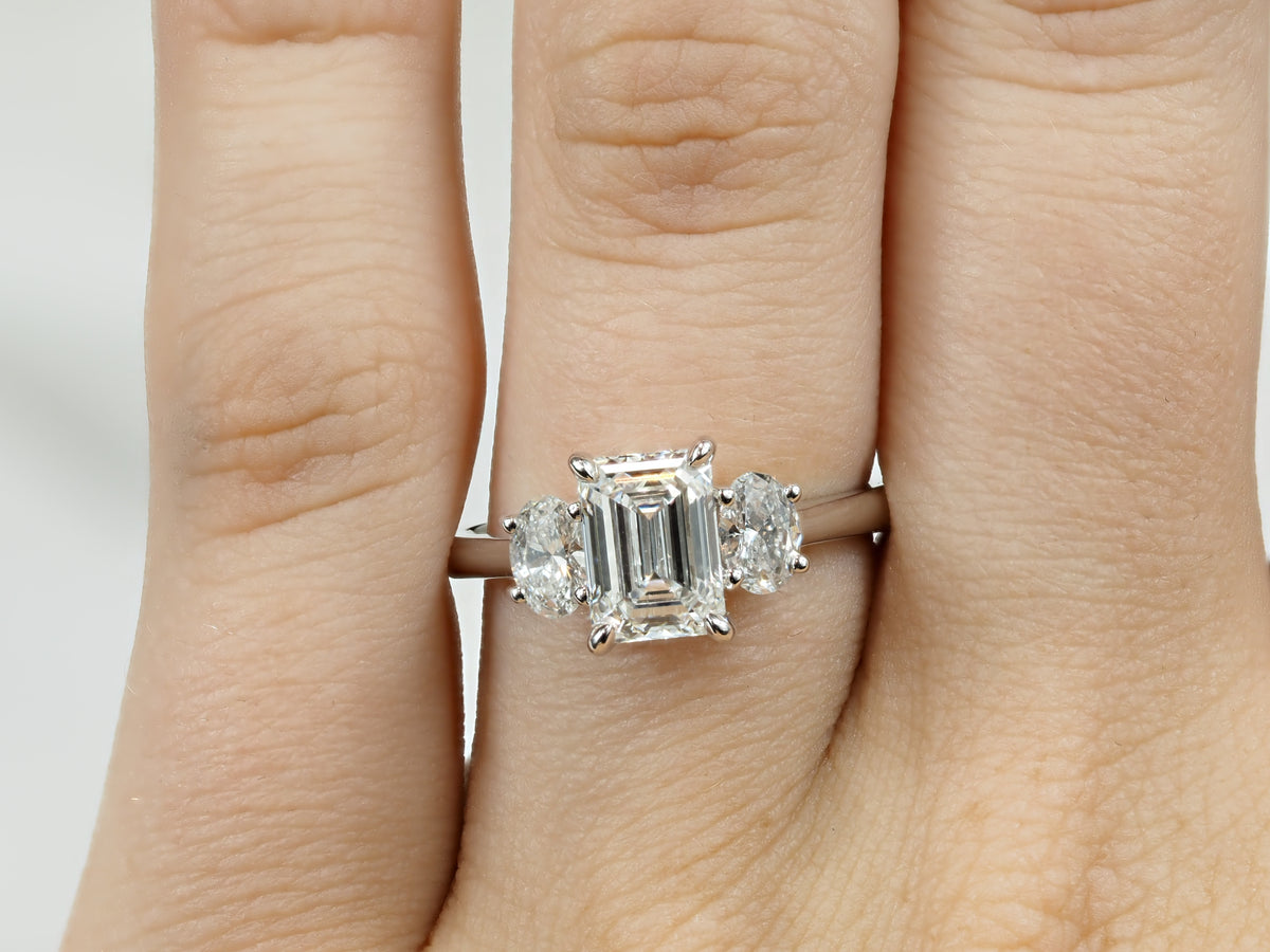 18ct White Gold Lab-Grown Emerald & Oval Trilogy Diamond Engagement Ring, 2.08ct total