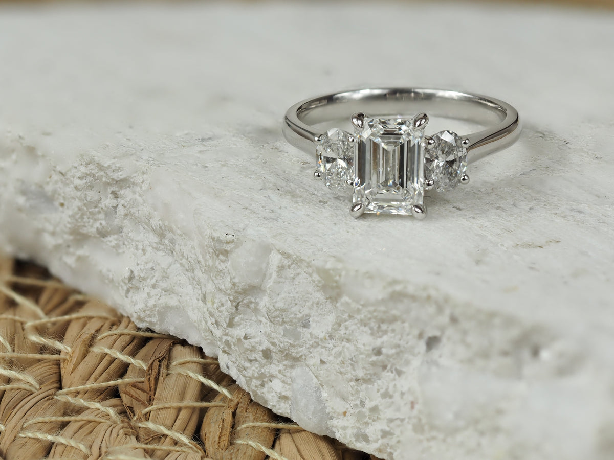 18ct White Gold Lab-Grown Emerald & Oval Trilogy Diamond Engagement Ring, 2.08ct total