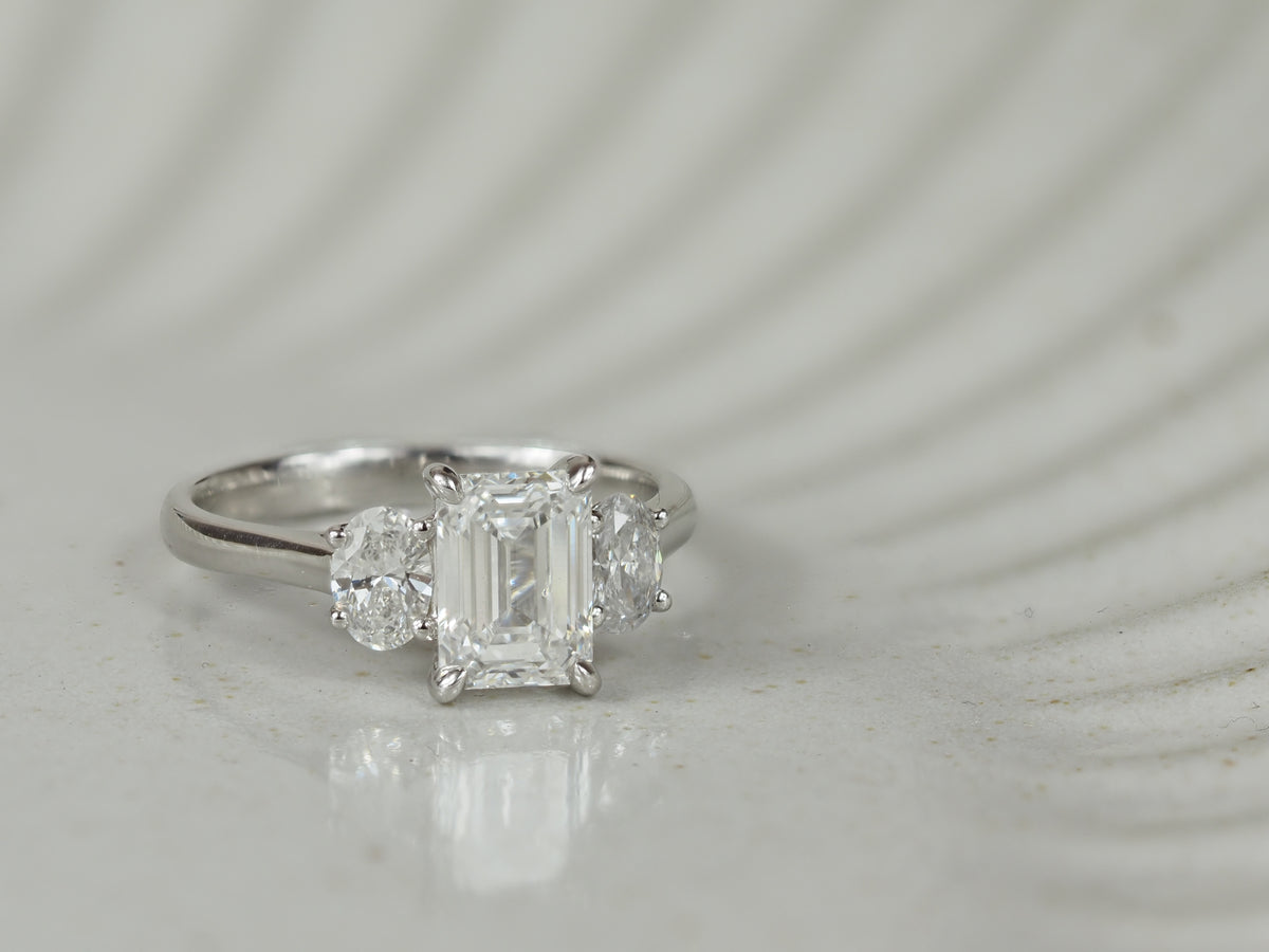 18ct White Gold Lab-Grown Emerald & Oval Trilogy Diamond Engagement Ring, 2.08ct total