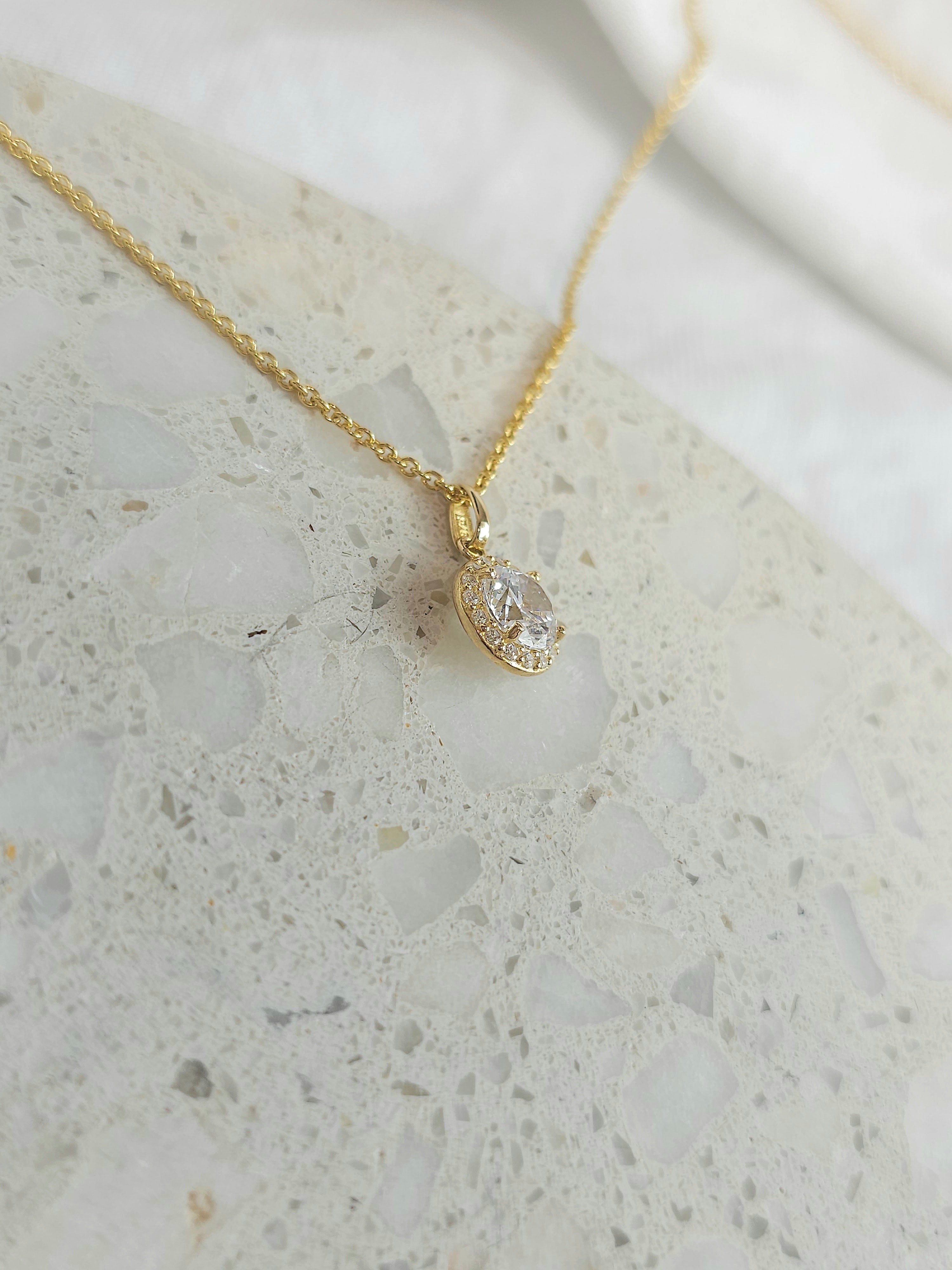 9ct gold stone set halo pendant
