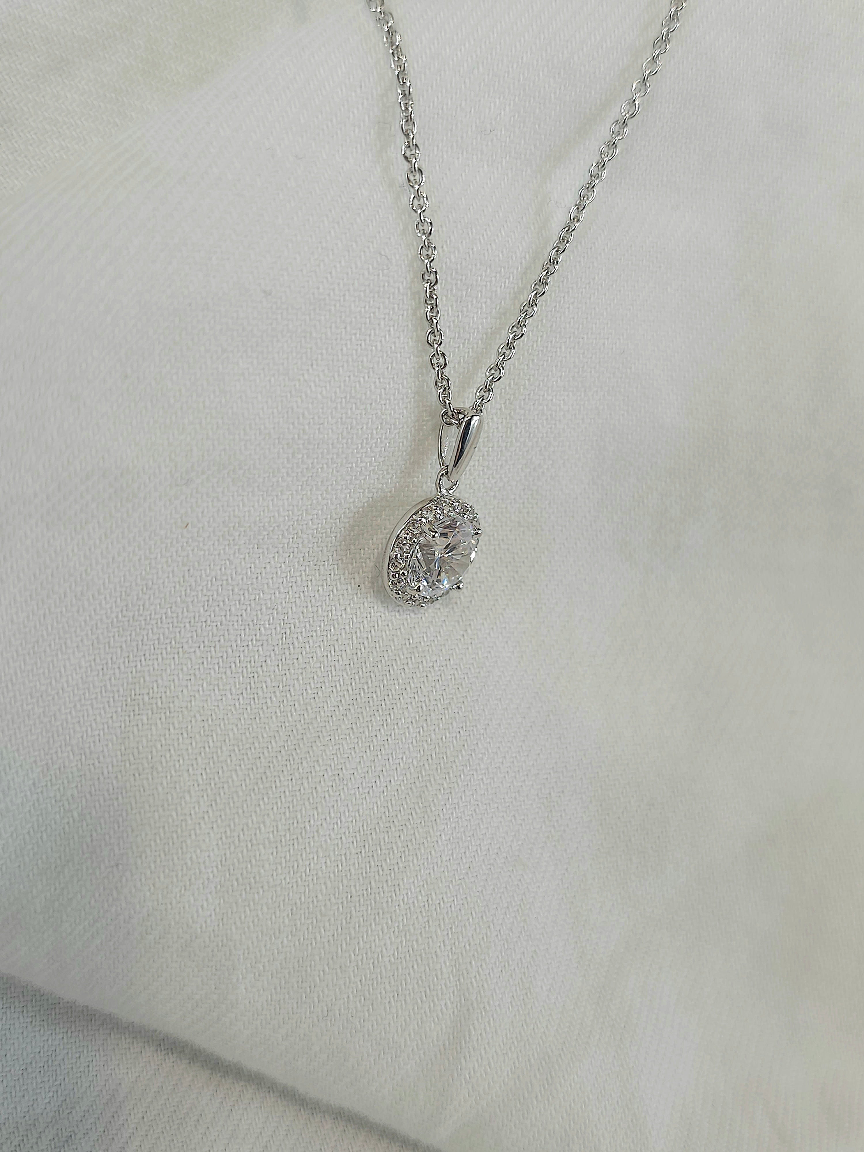 9ct white gold stone set halo pendant
