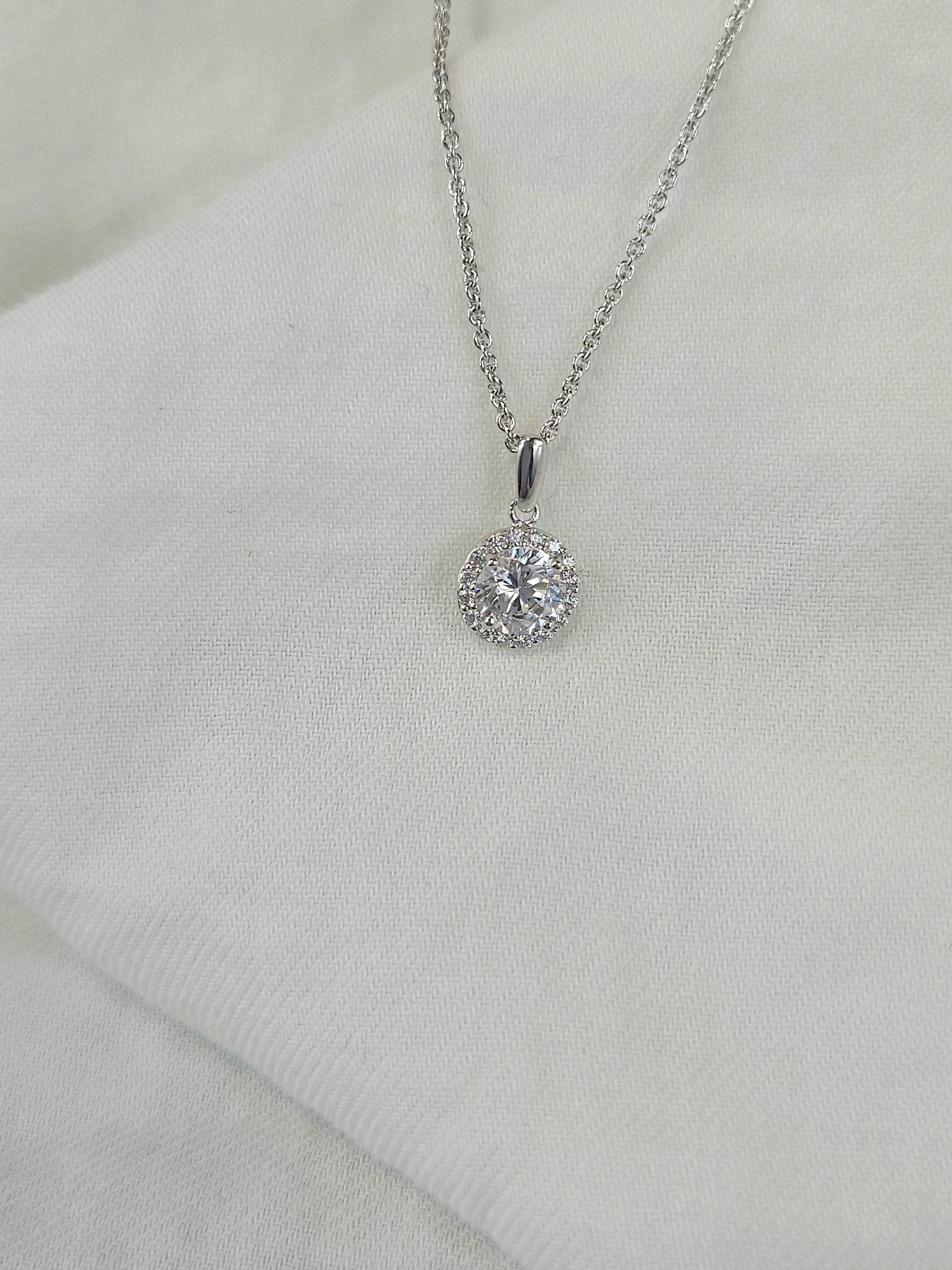 9ct white gold stone set halo pendant