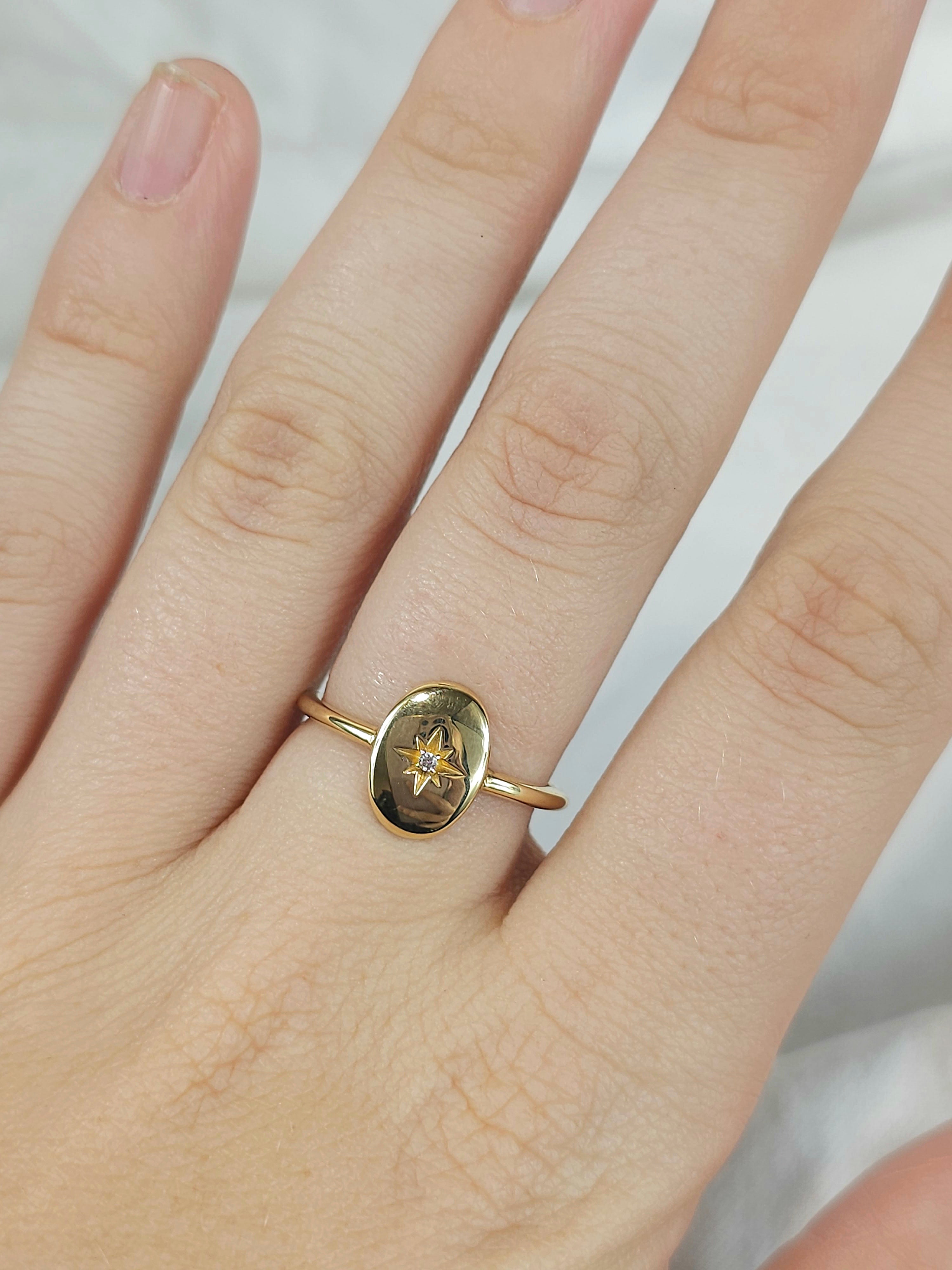 9ct oval disc signet ring with star set cubic zirconia