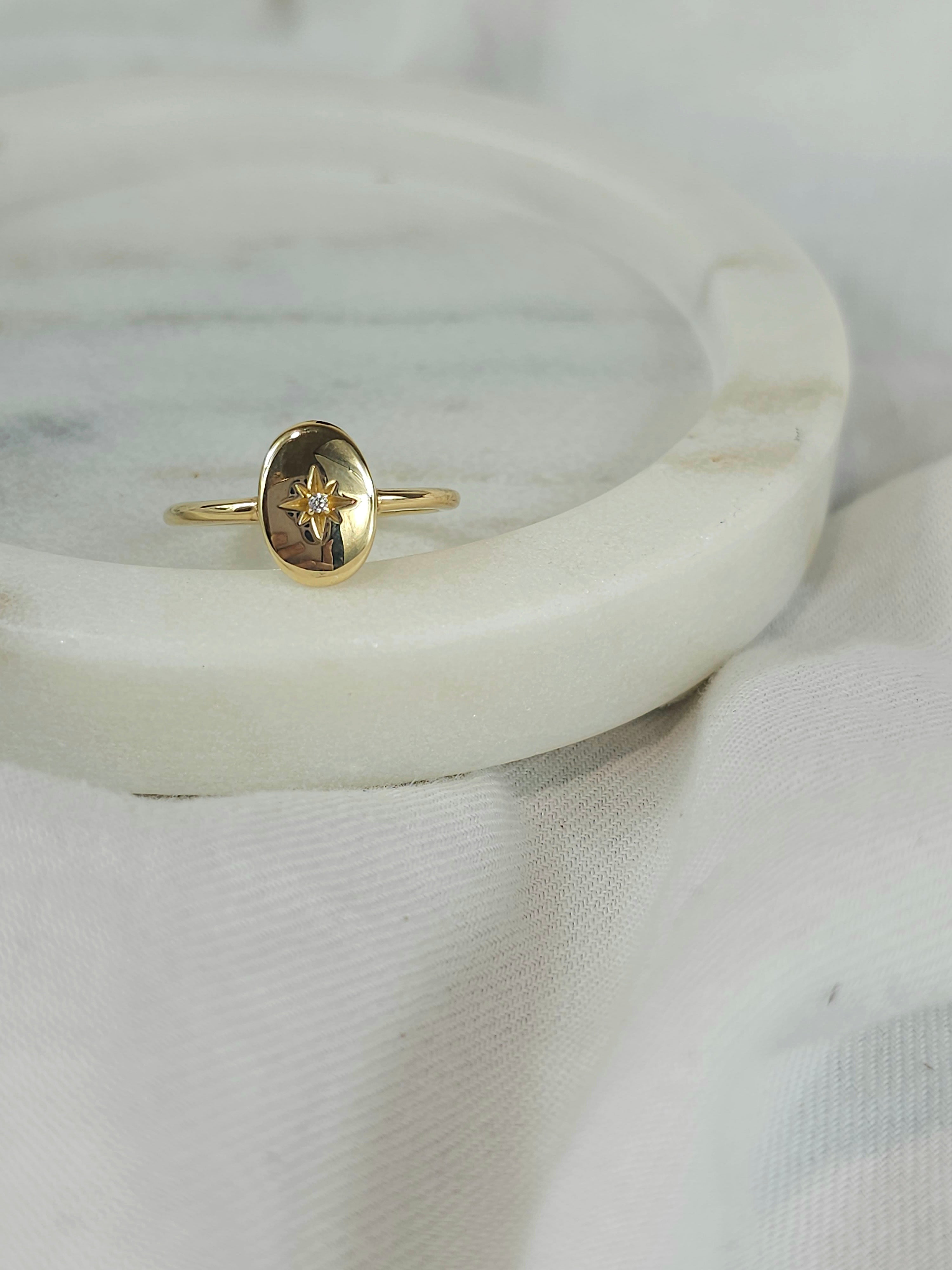9ct oval disc signet ring with star set cubic zirconia