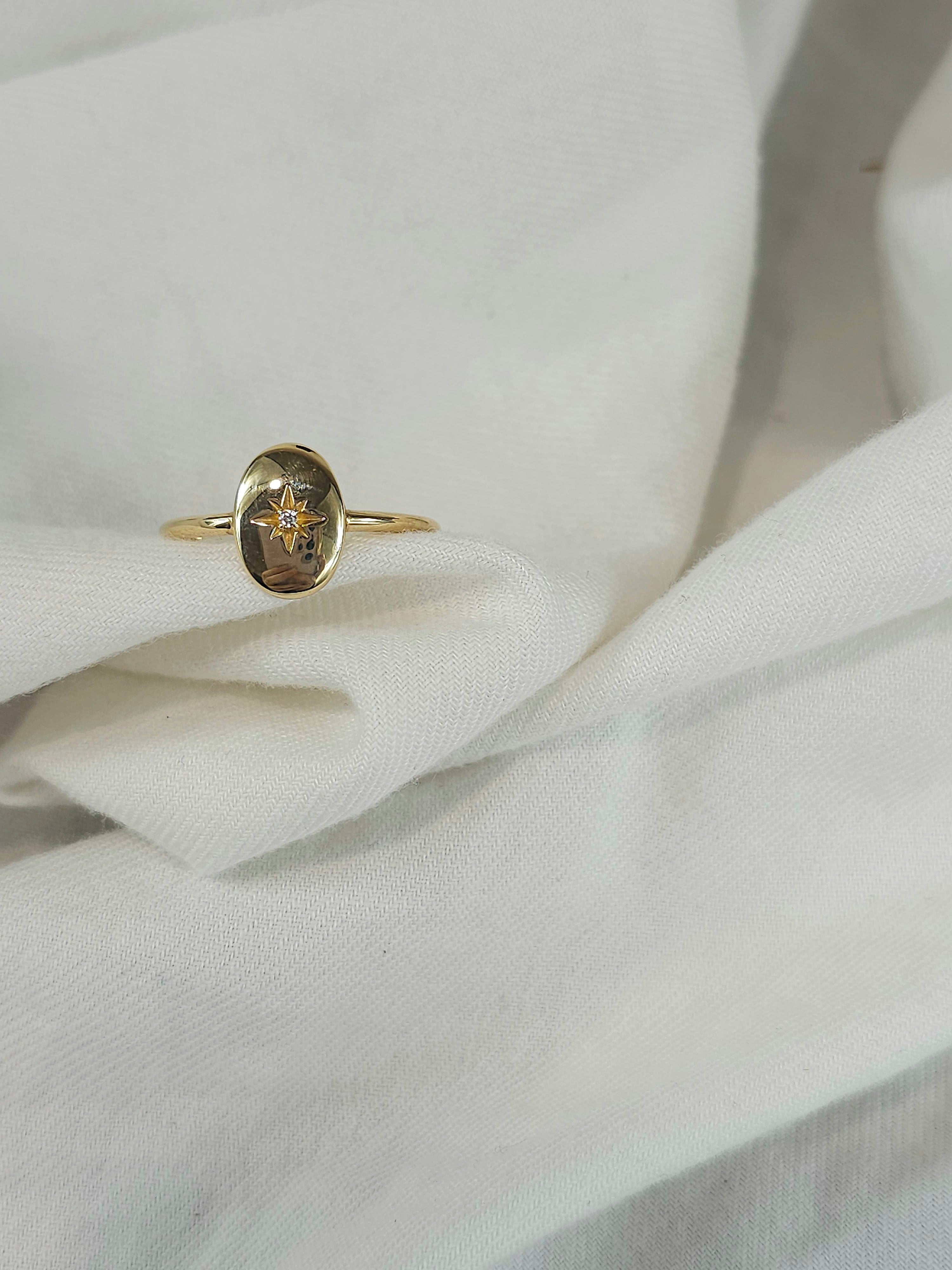 9ct oval disc signet ring with star set cubic zirconia