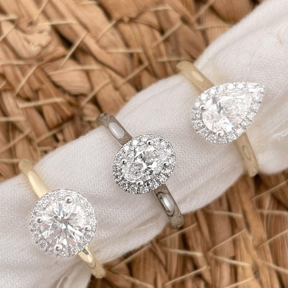 18ct White Gold Oval Halo Ring, 0.50 carat centre.