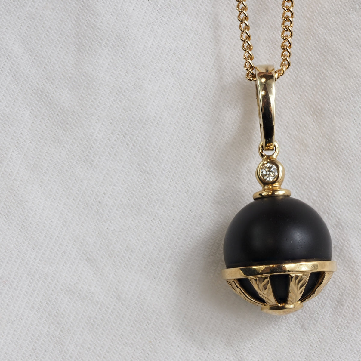 9ct Yellow Gold Round Onyx and Diamond pendant