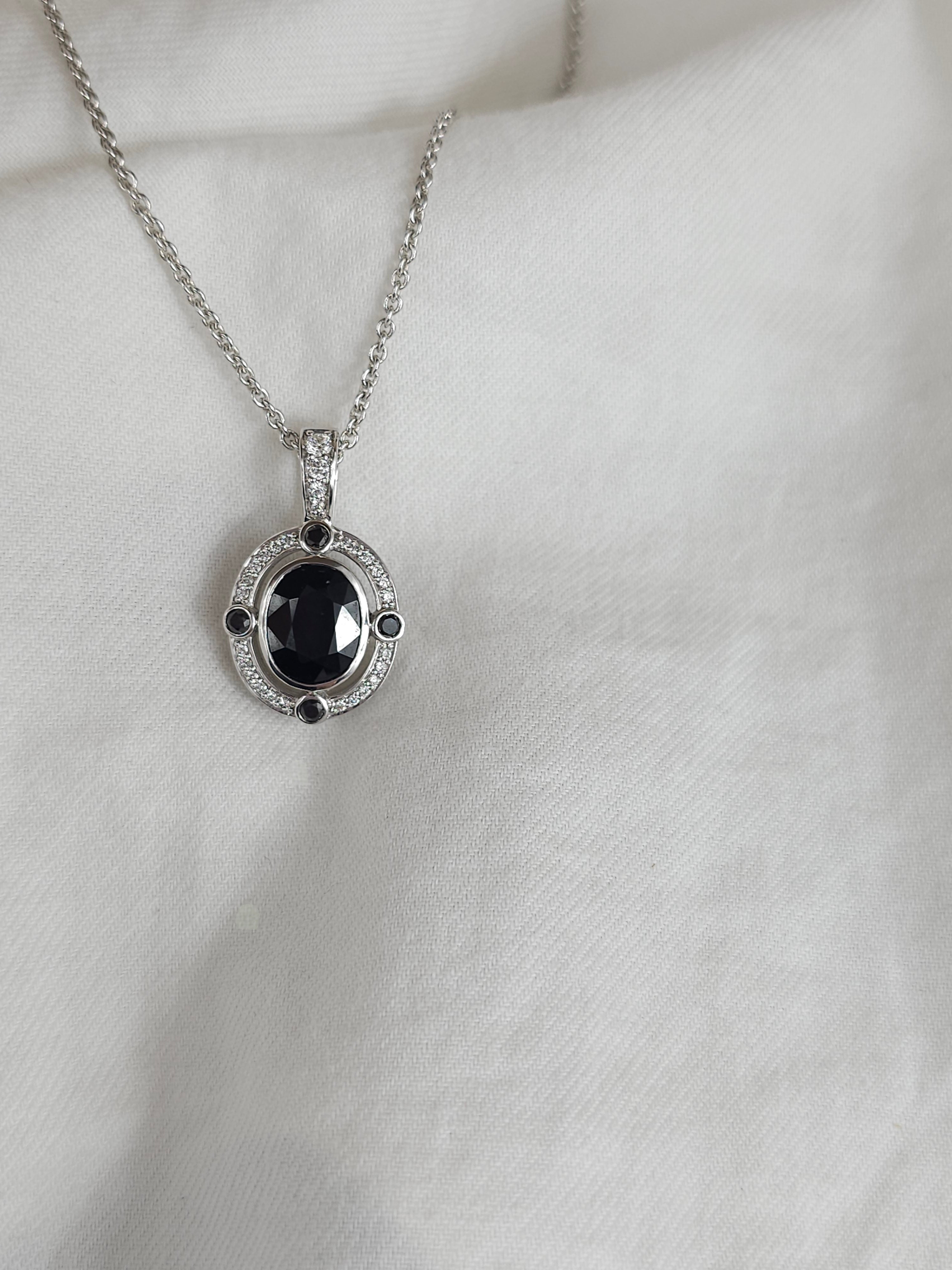 9ct White Gold Sapphire, Diamond and Black Diamond pendant