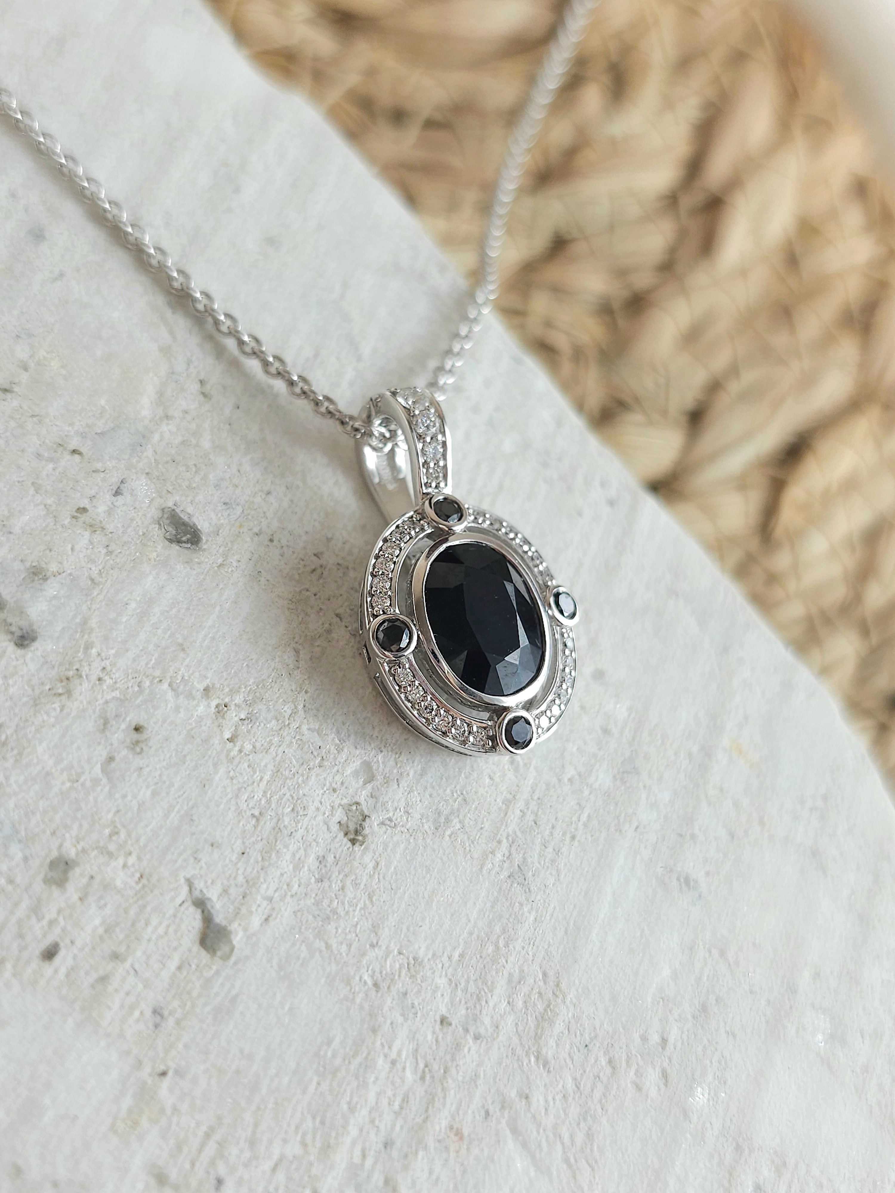 9ct White Gold Sapphire, Diamond and Black Diamond pendant
