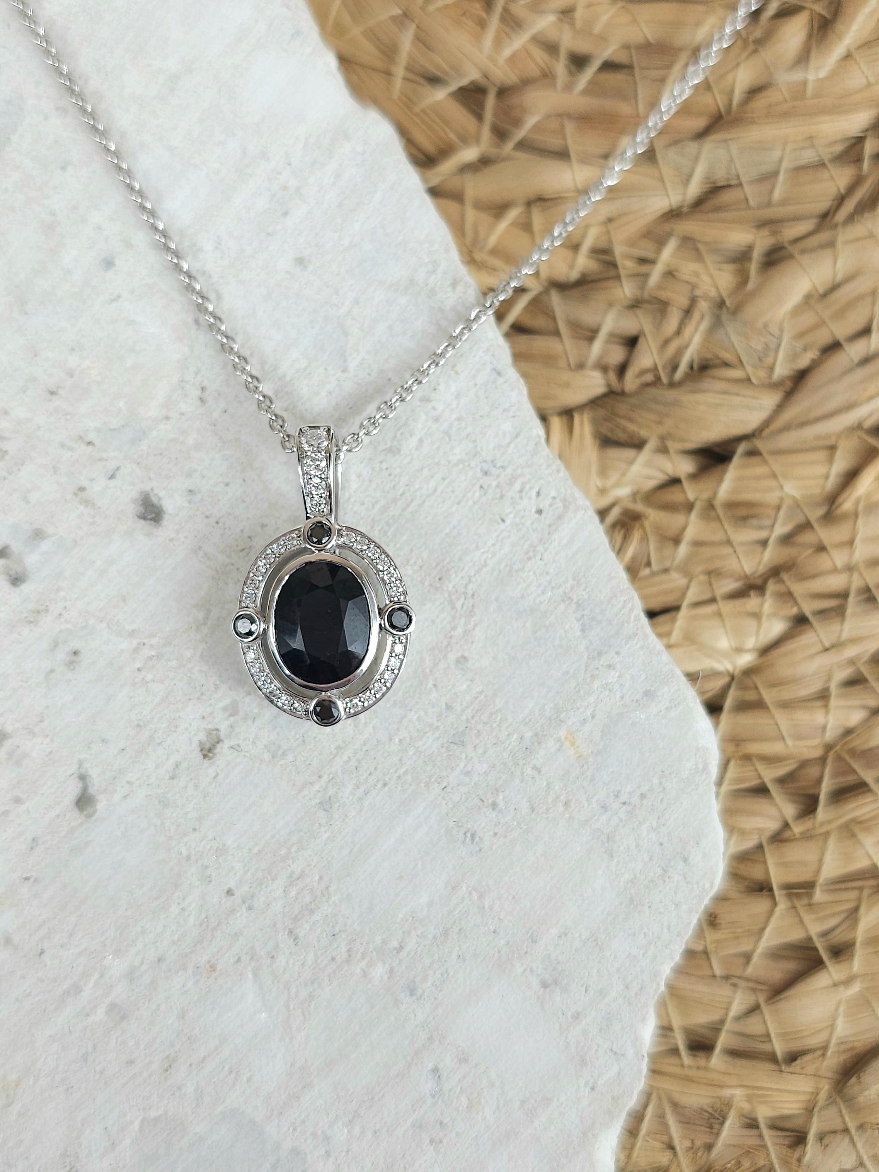 9ct White Gold Sapphire, Diamond and Black Diamond pendant
