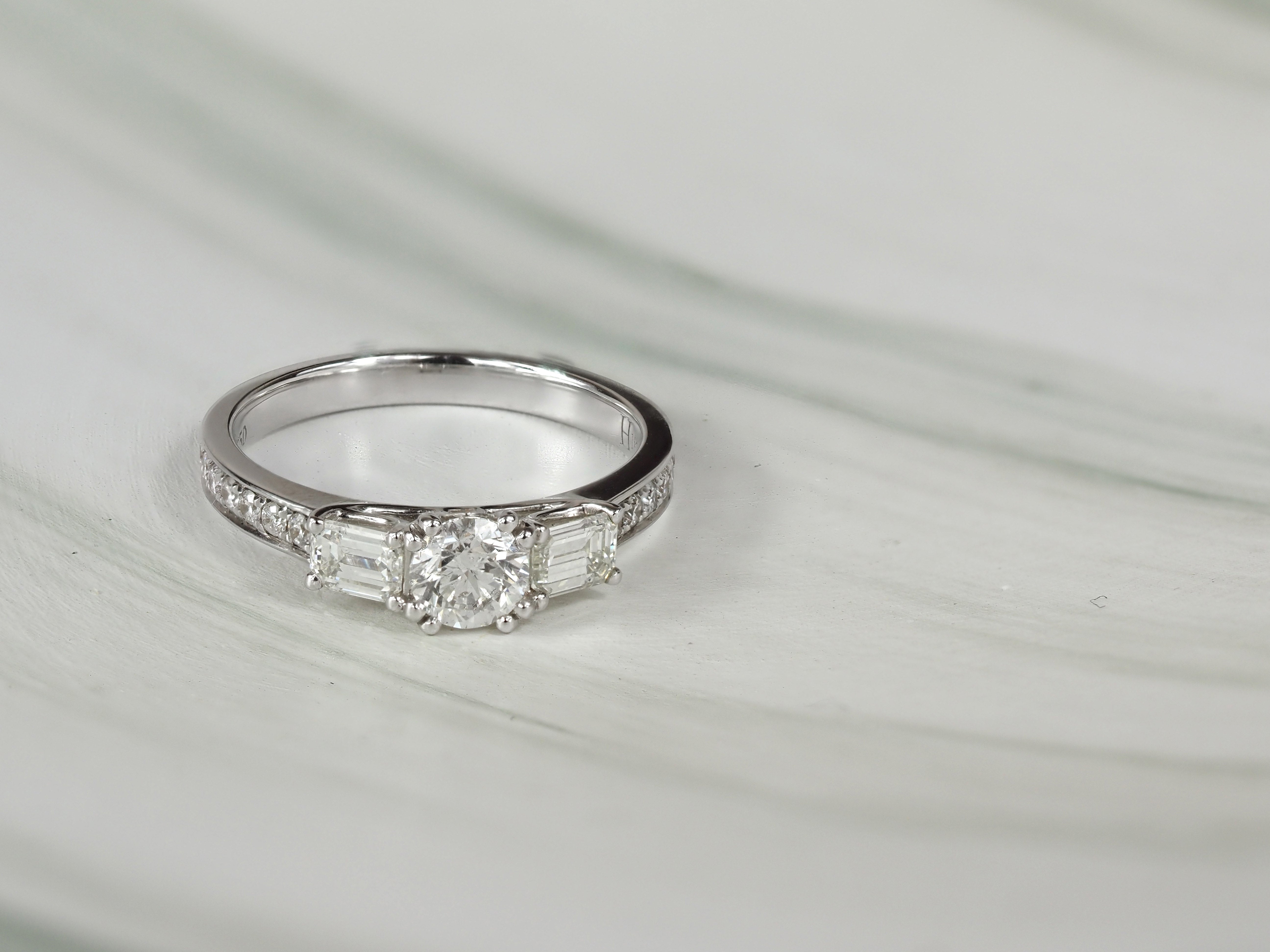 18ct White Gold Round and Emerald Cut Diamond Engagement Ring, 0.40ct Centre