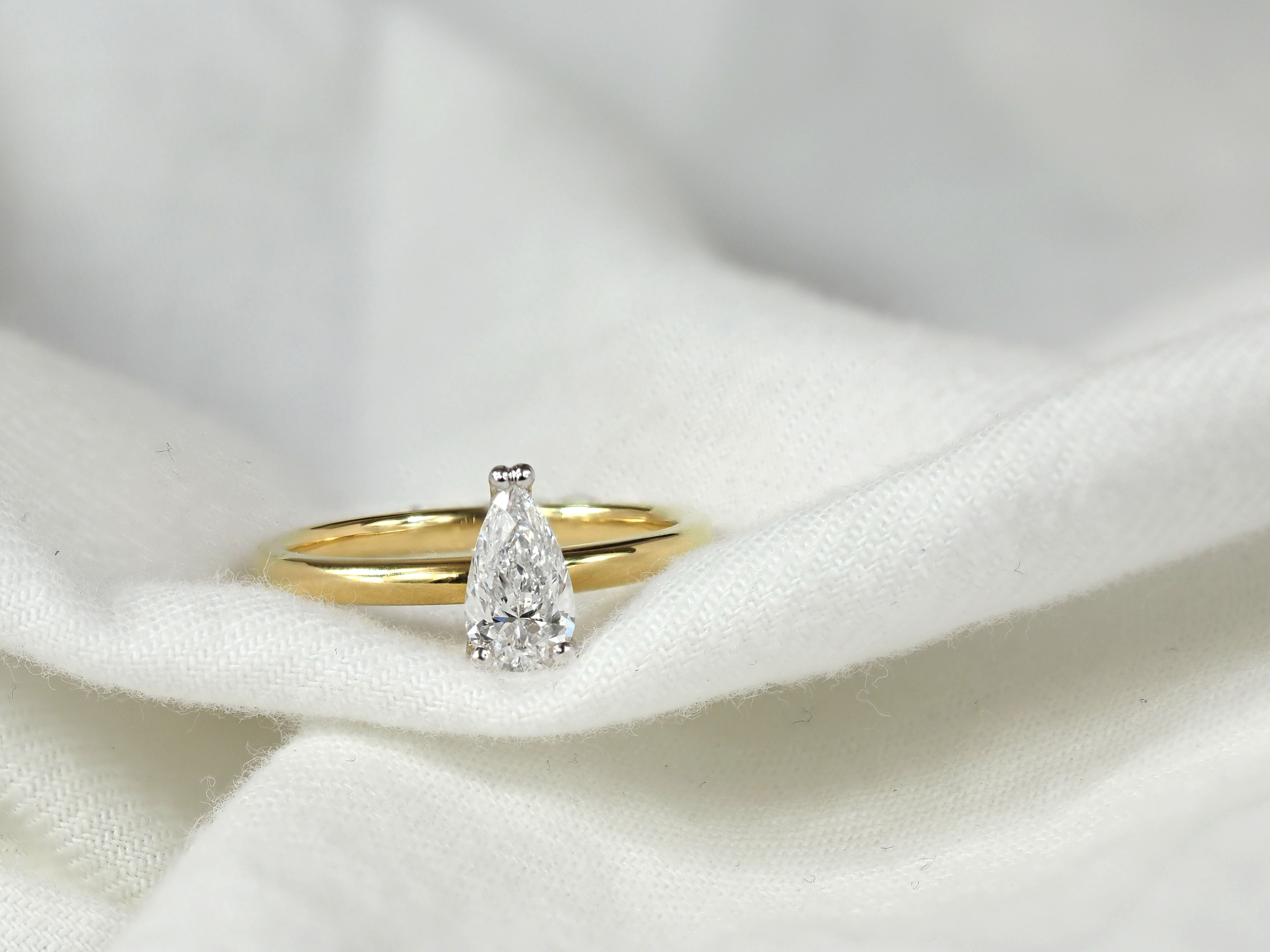 18ct Yellow and White Gold Pear Cut Diamond Engagement Ring, 0.71ct Centre
