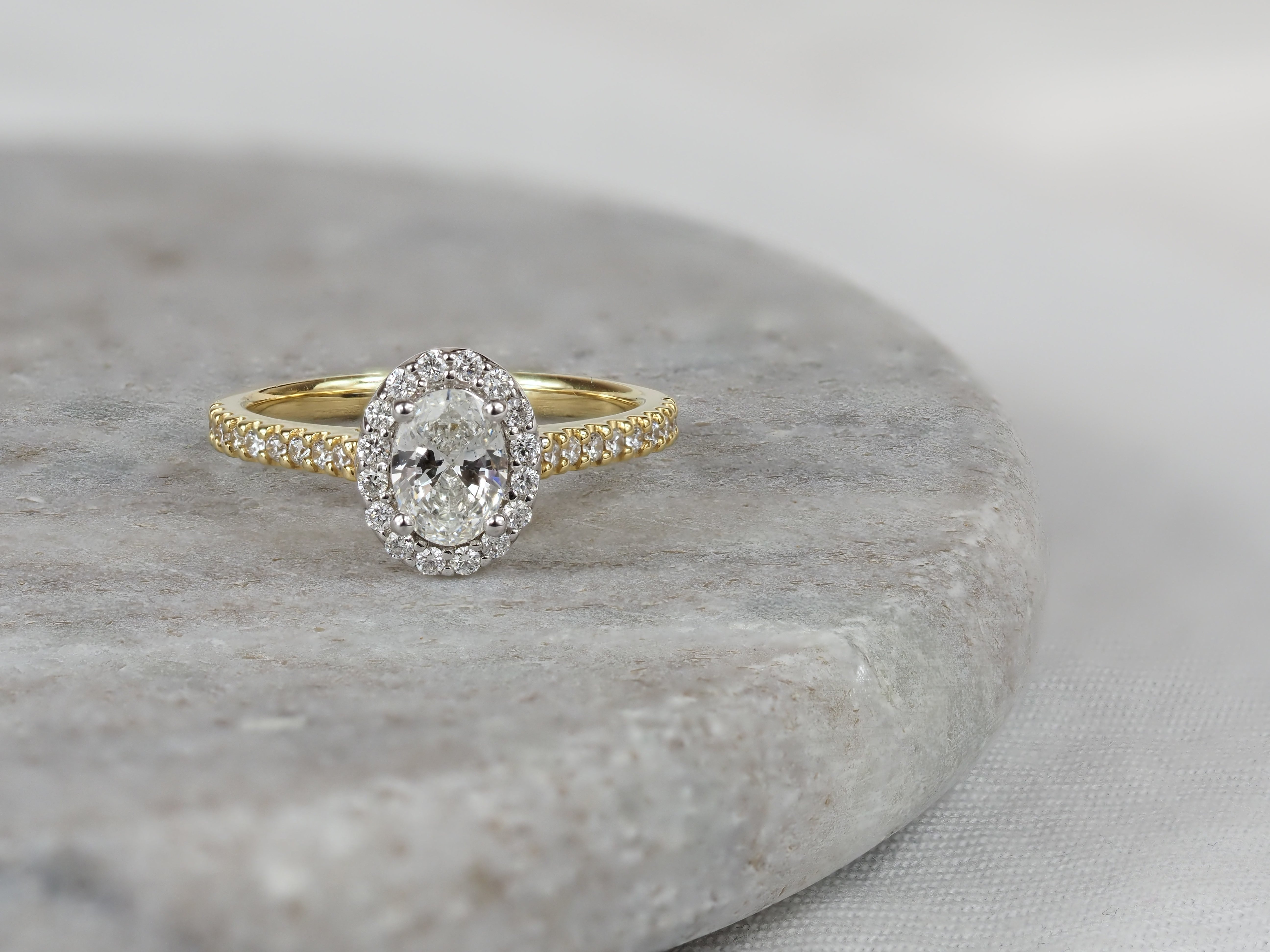 18ct Yellow and White Gold Oval Halo Engagement Ring, 0.56ct centre