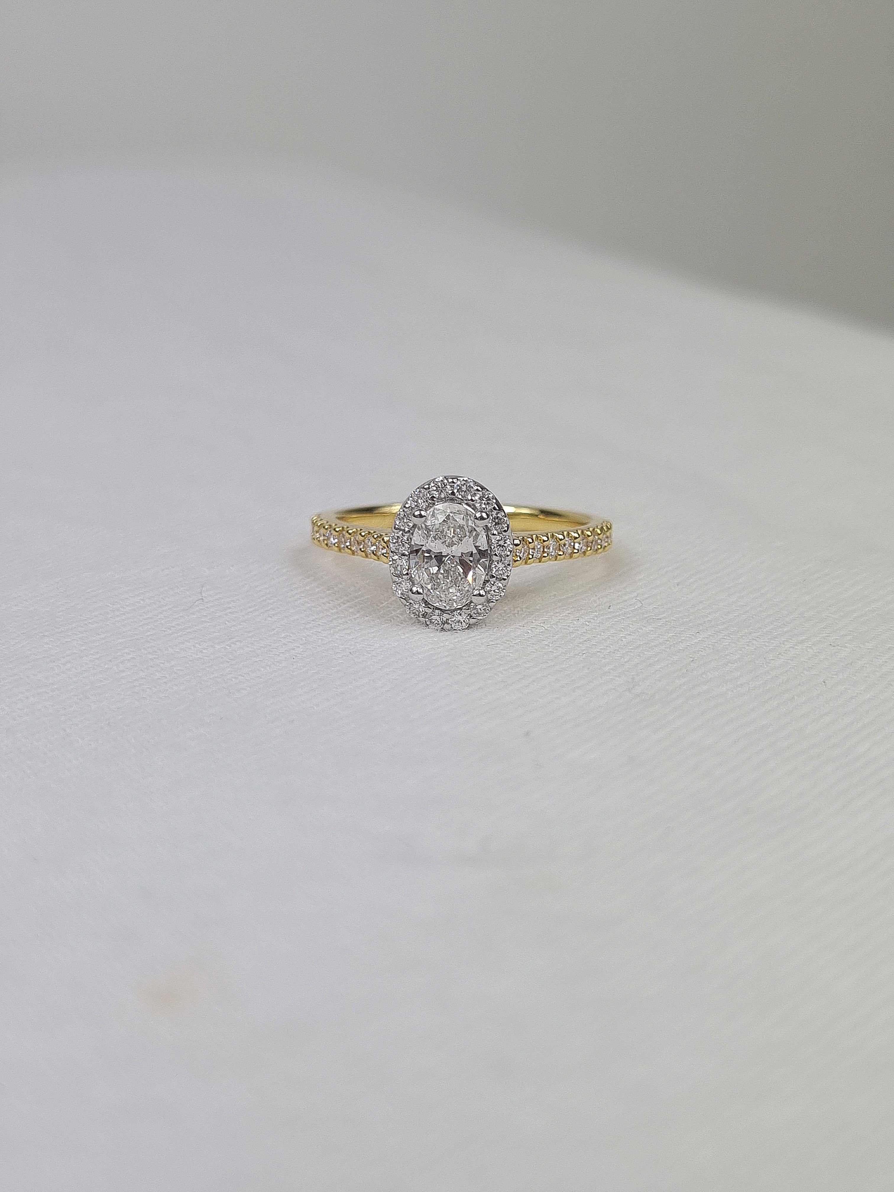 18ct Yellow and White Gold Oval Halo Engagement Ring, 0.56ct centre