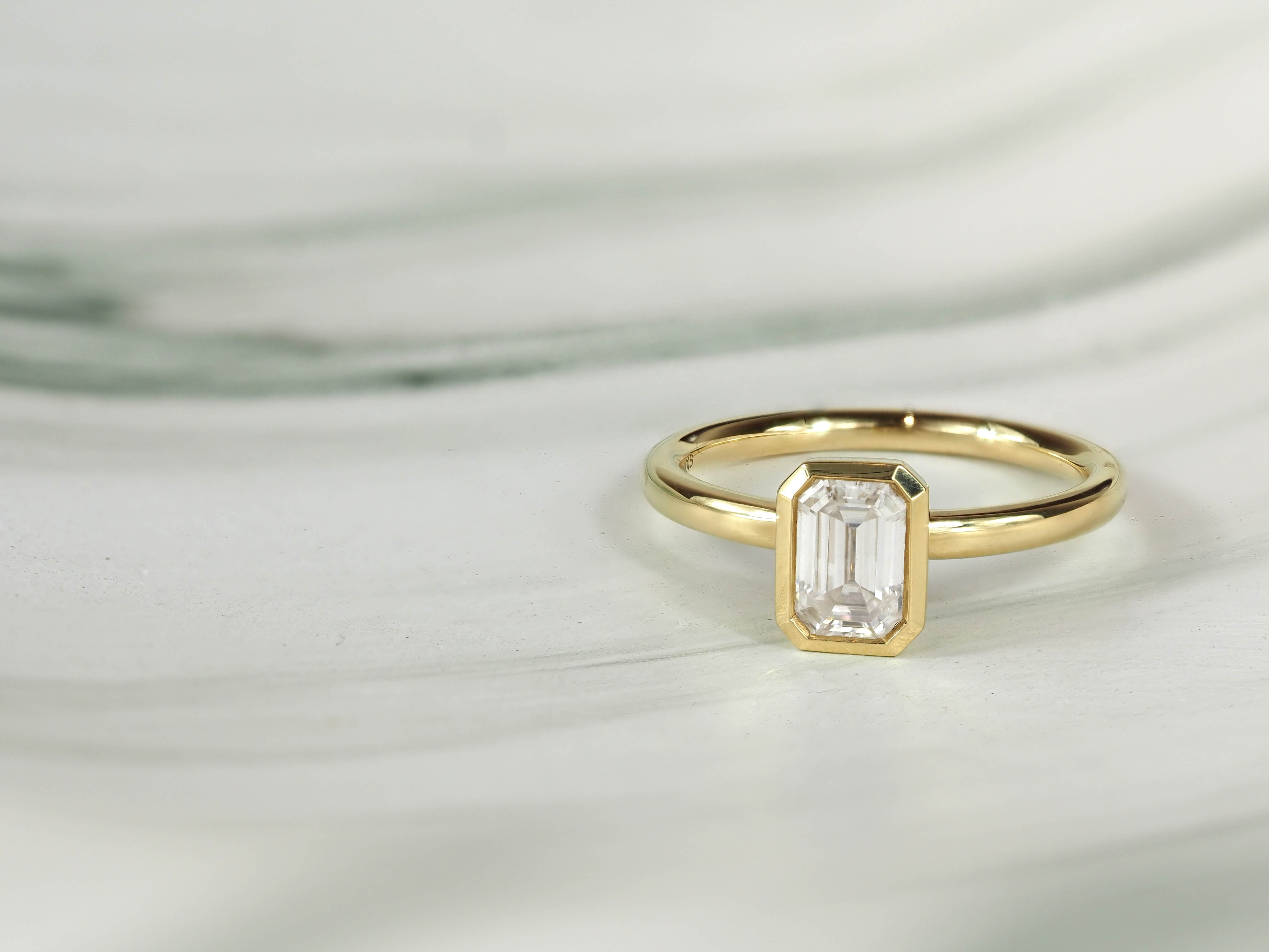 18ct Yellow Gold Emerald Cut Moissanite Solitaire.