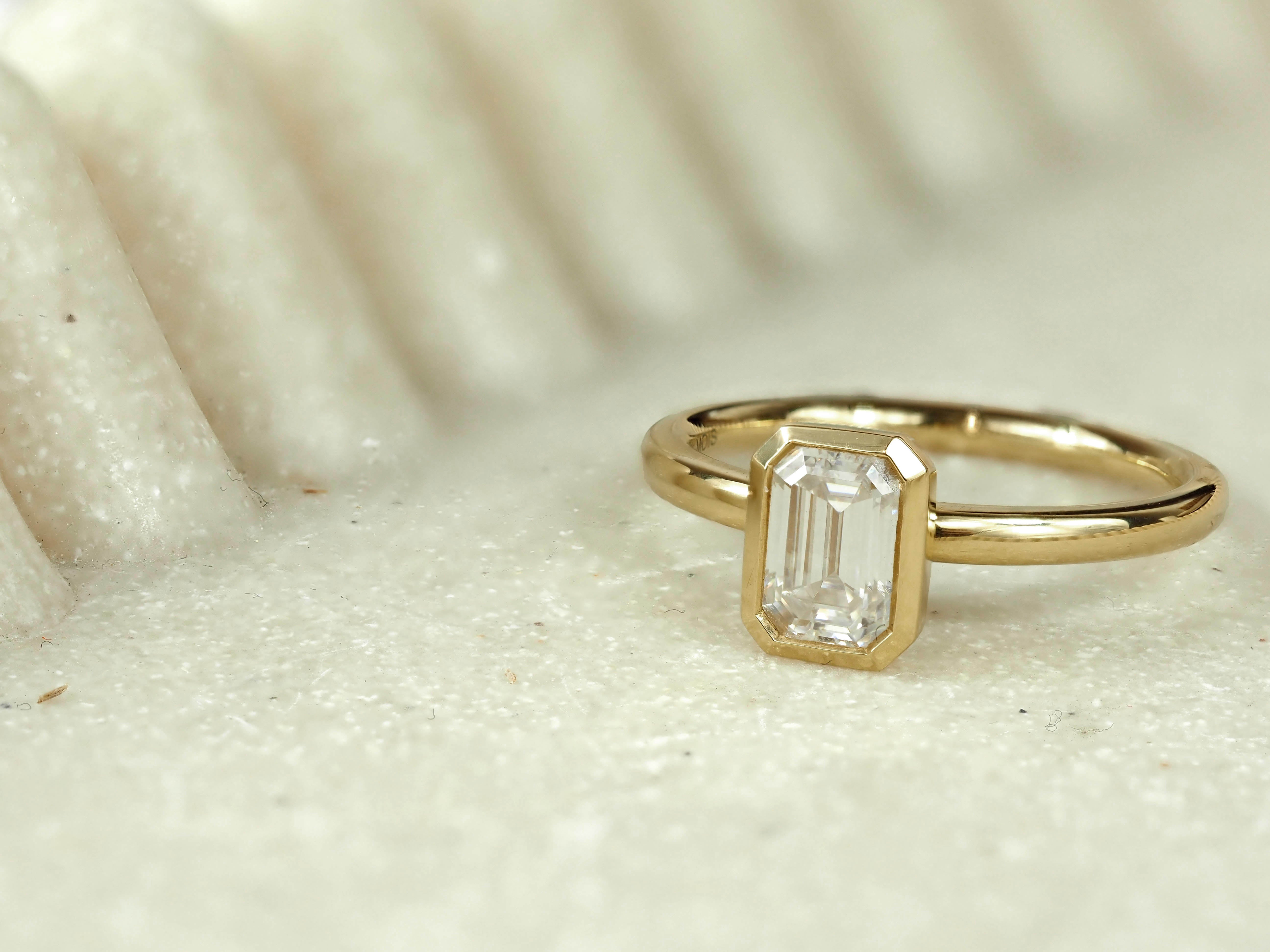 18ct Yellow Gold Emerald Cut Moissanite Solitaire.