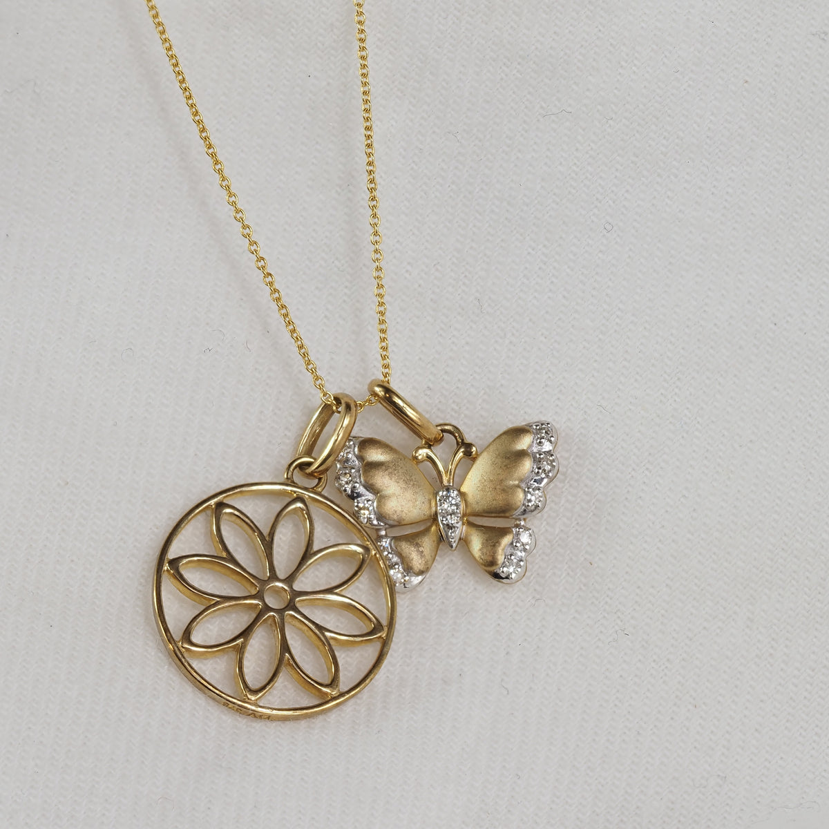 9ct Yellow and White Gold Diamond set Butterfly pendant and cut out flower pendant