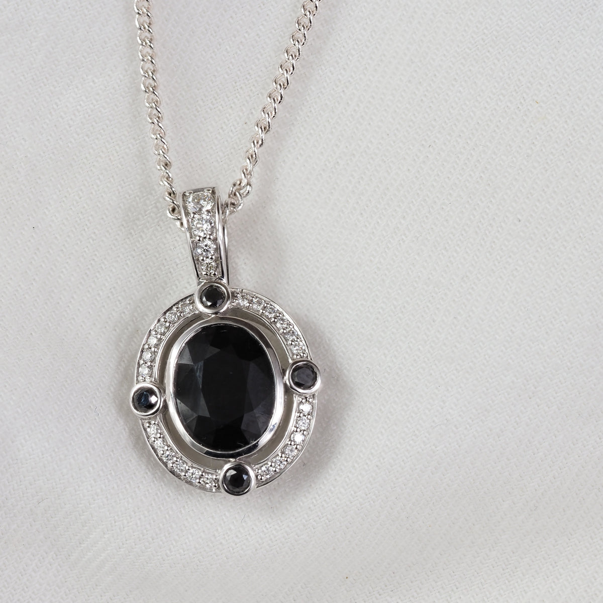 9ct White Gold Sapphire, Diamond and Black Diamond pendant