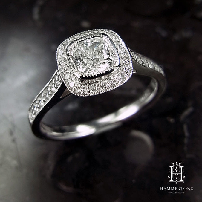 18 Carat White Gold Cushion Halo Engagement Ring, 0.72 carats.
